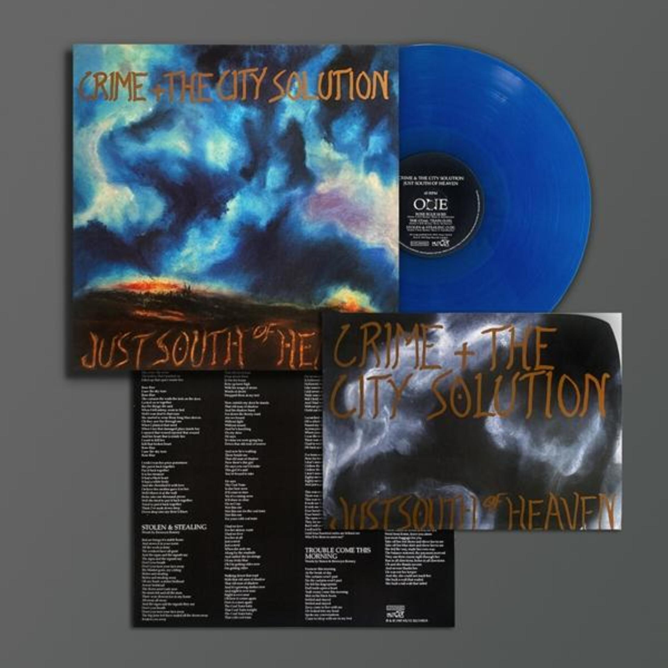 Copertina dell'album. Disco in vinile blu e copertina. Gruppo: Crime & the City Solution. Titolo: Just South of Heaven.