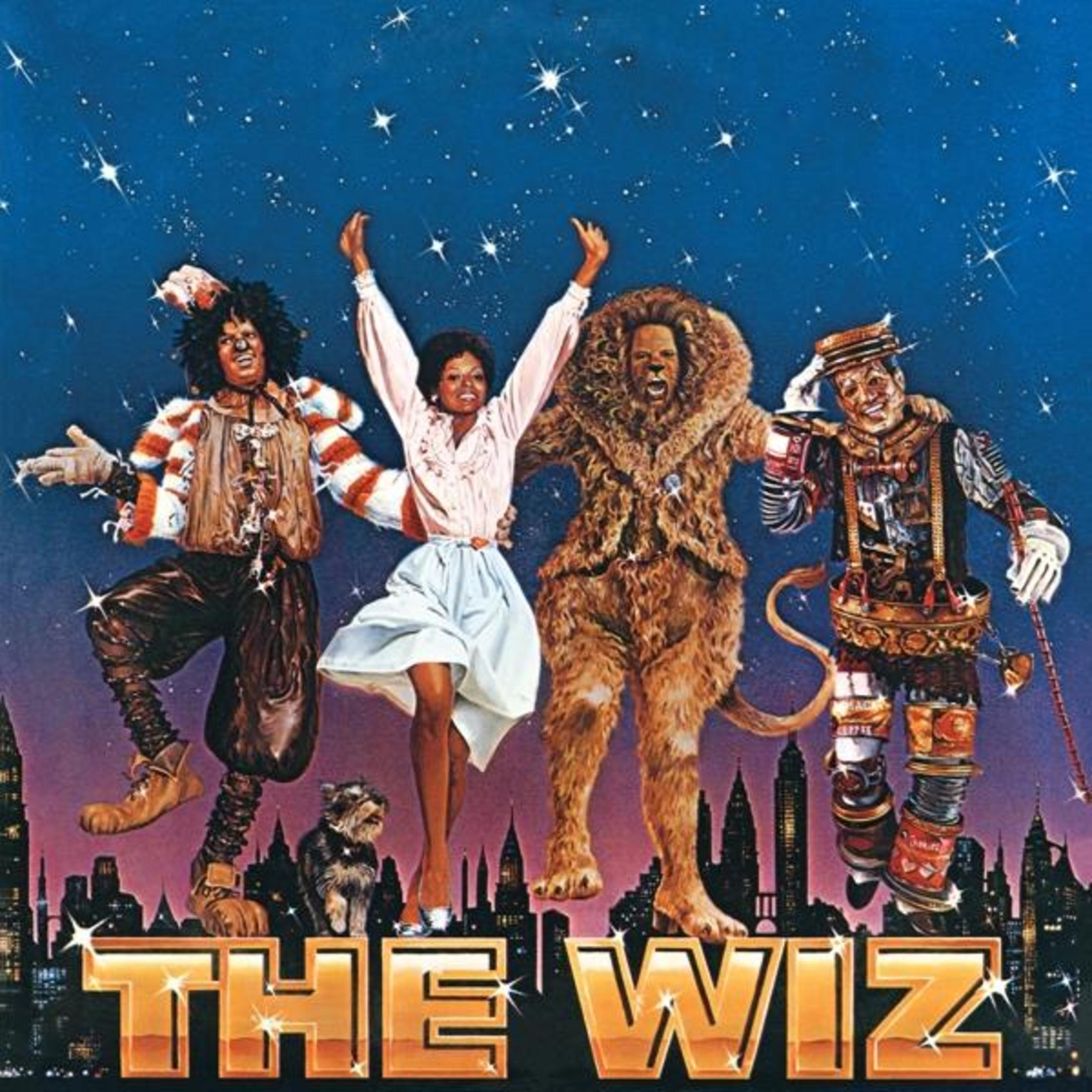 Copertina dell'album di The Wiz, un film con star davanti a una città di notte. Il titolo è in oro.