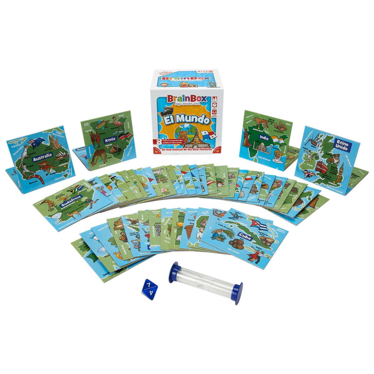 Juego BrainBox con cartas, dados y reloj de arena. Las cartas muestran mapas del mundo y banderas, en una superficie blanca.