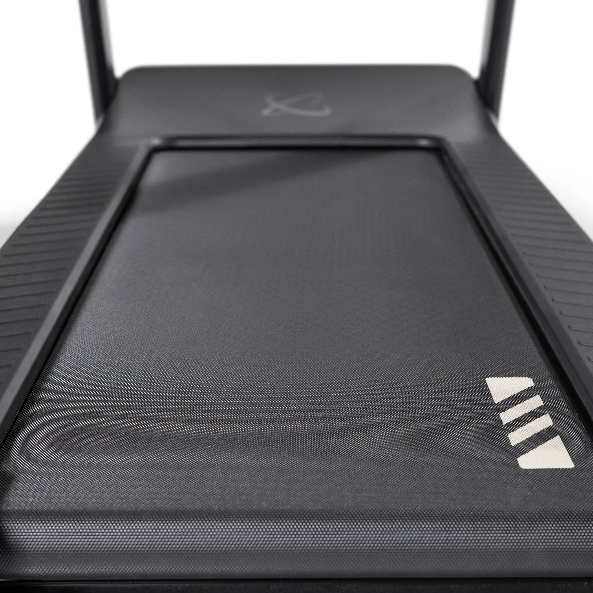 Black treadmill with a textured running surface. The frame is black and the brand logo is visible.