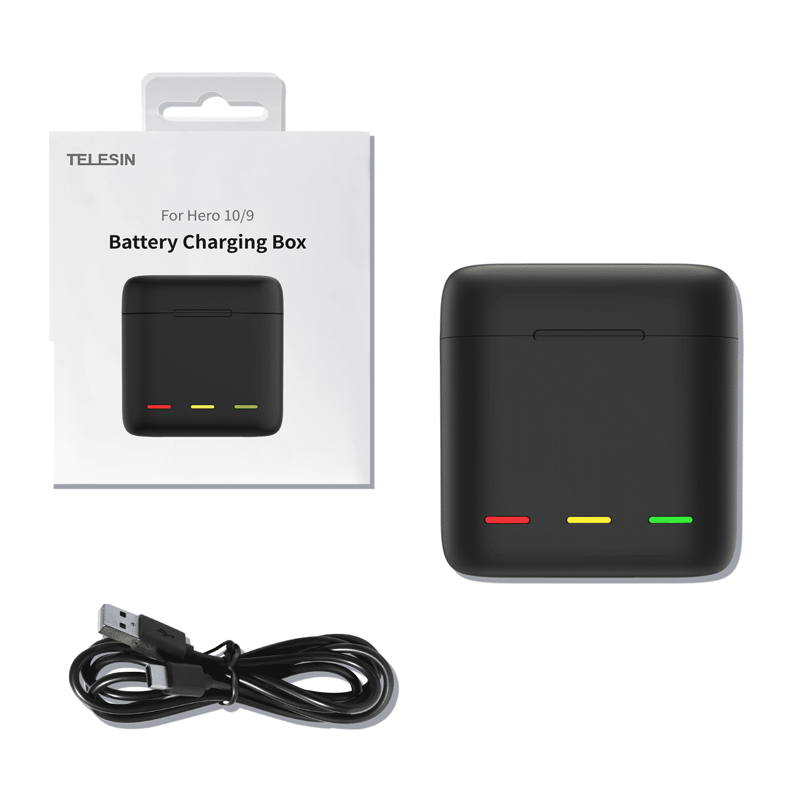 Czarny pojemnik ładujący i jego opakowanie, z kablem USB na białej powierzchni.