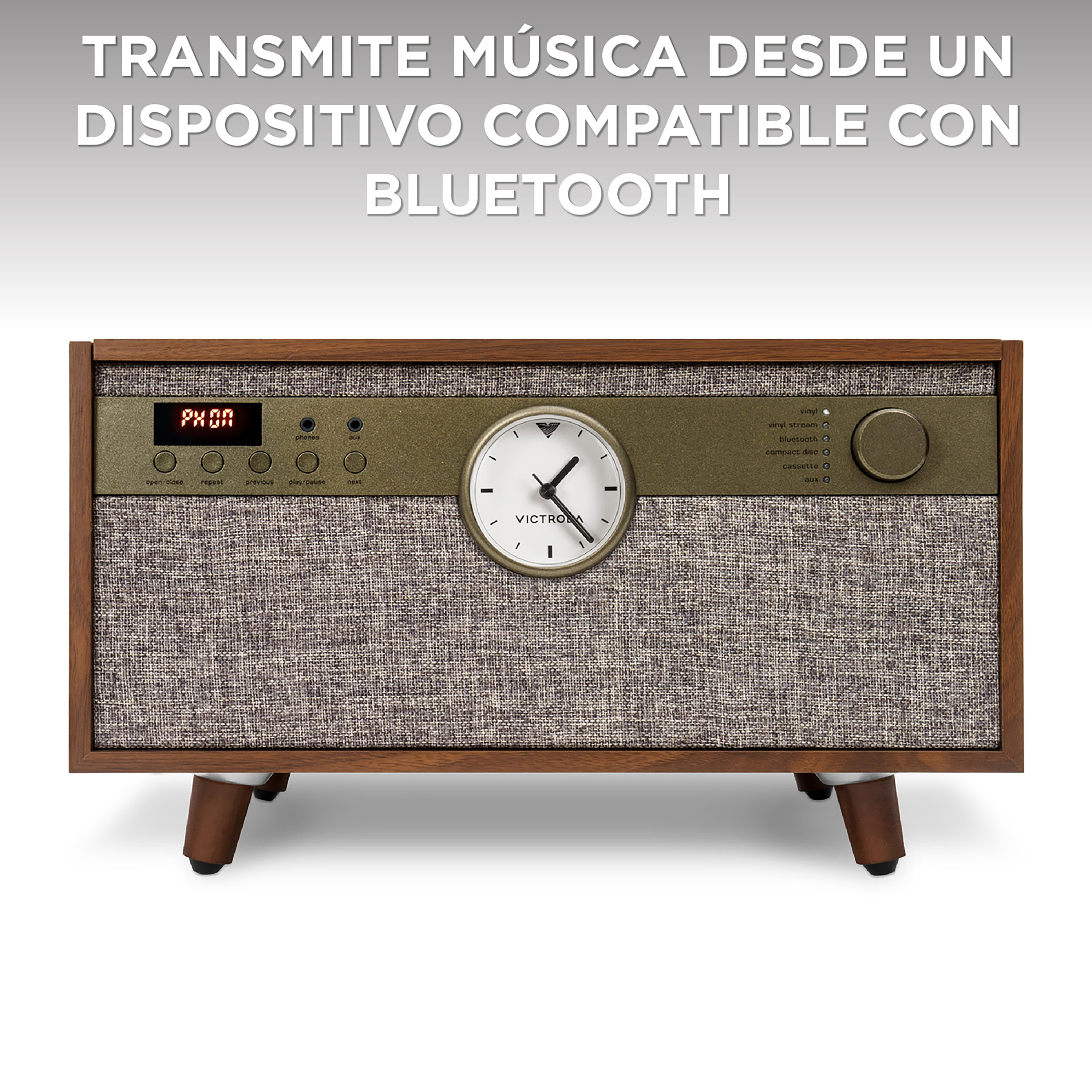 Radio in stile vintage con orologio. Cornice in legno, fronte in tessuto e dettagli metallici.