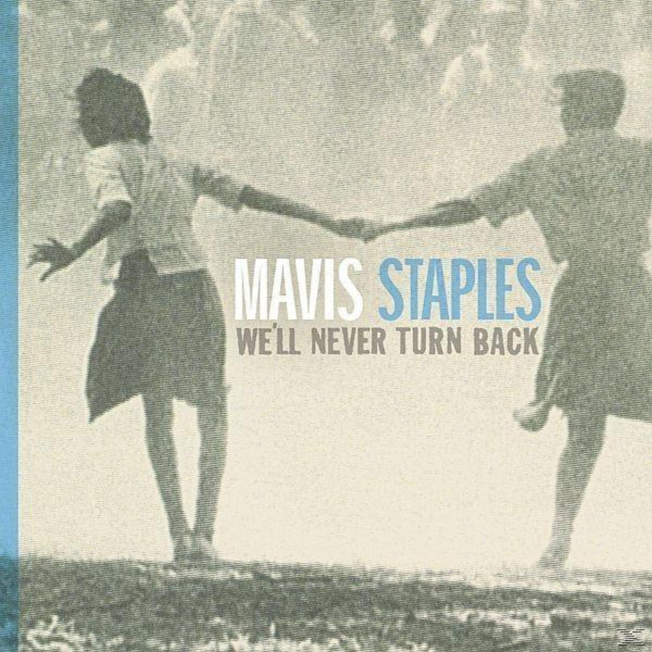 Image de deux silhouettes se tenant la main. Le texte dit 'MAVIS STAPLES'.