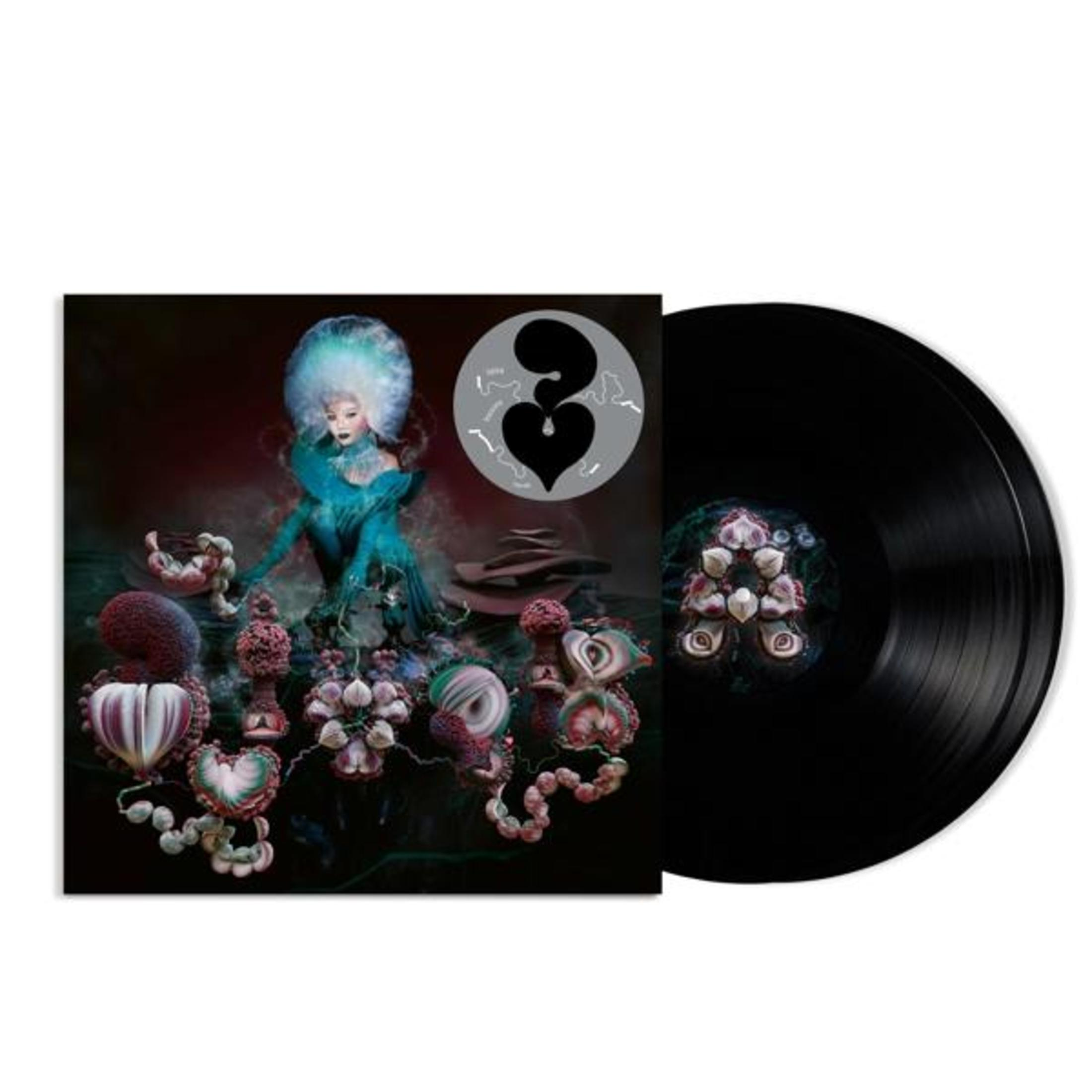 Portada del álbum con arte surrealista y un disco de vinilo negro.