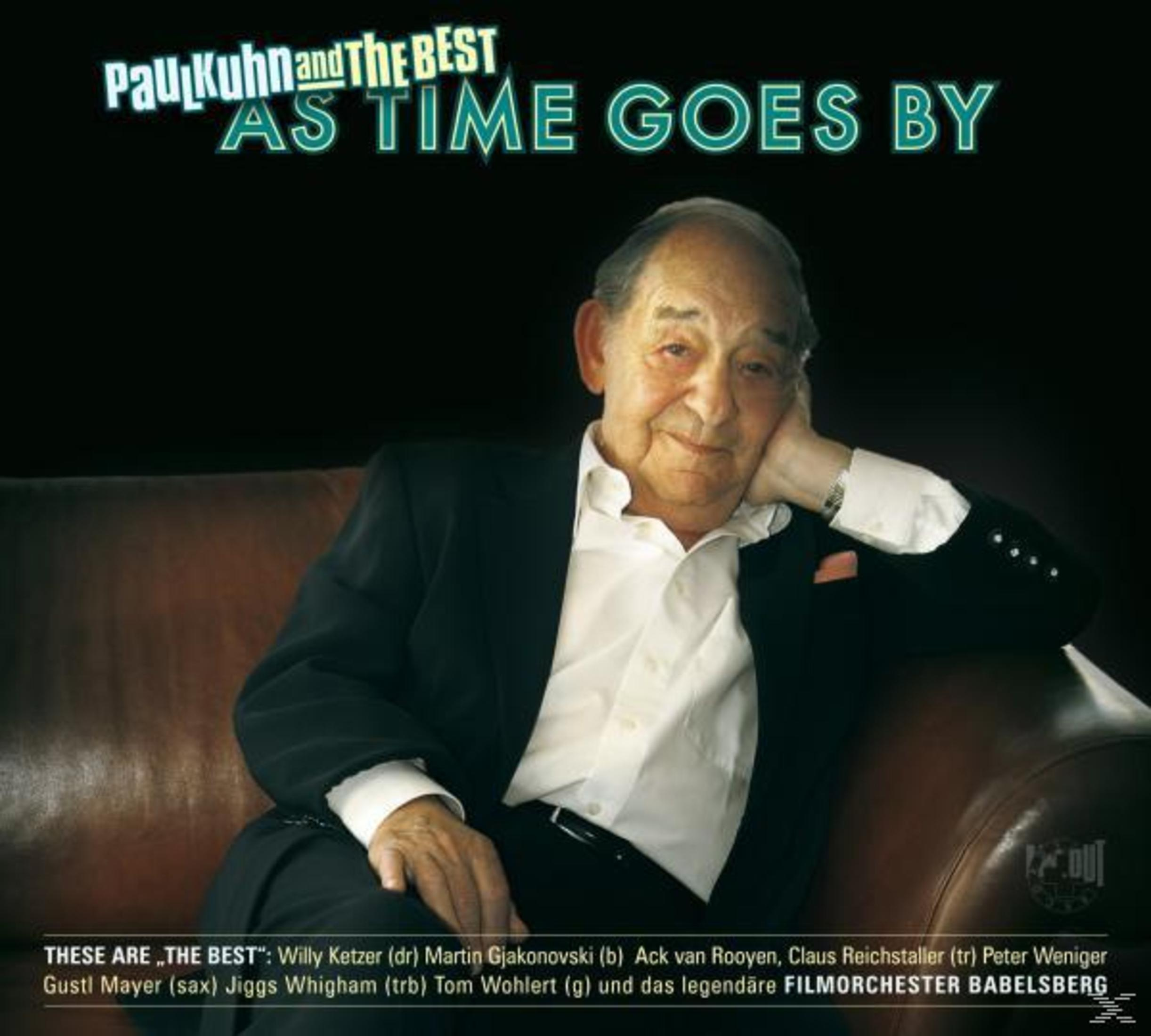 Pochette d'album de Paul Kuhn avec le titre 'As Time Goes By'. Un homme est assis sur un canapé. Le texte est en bas.