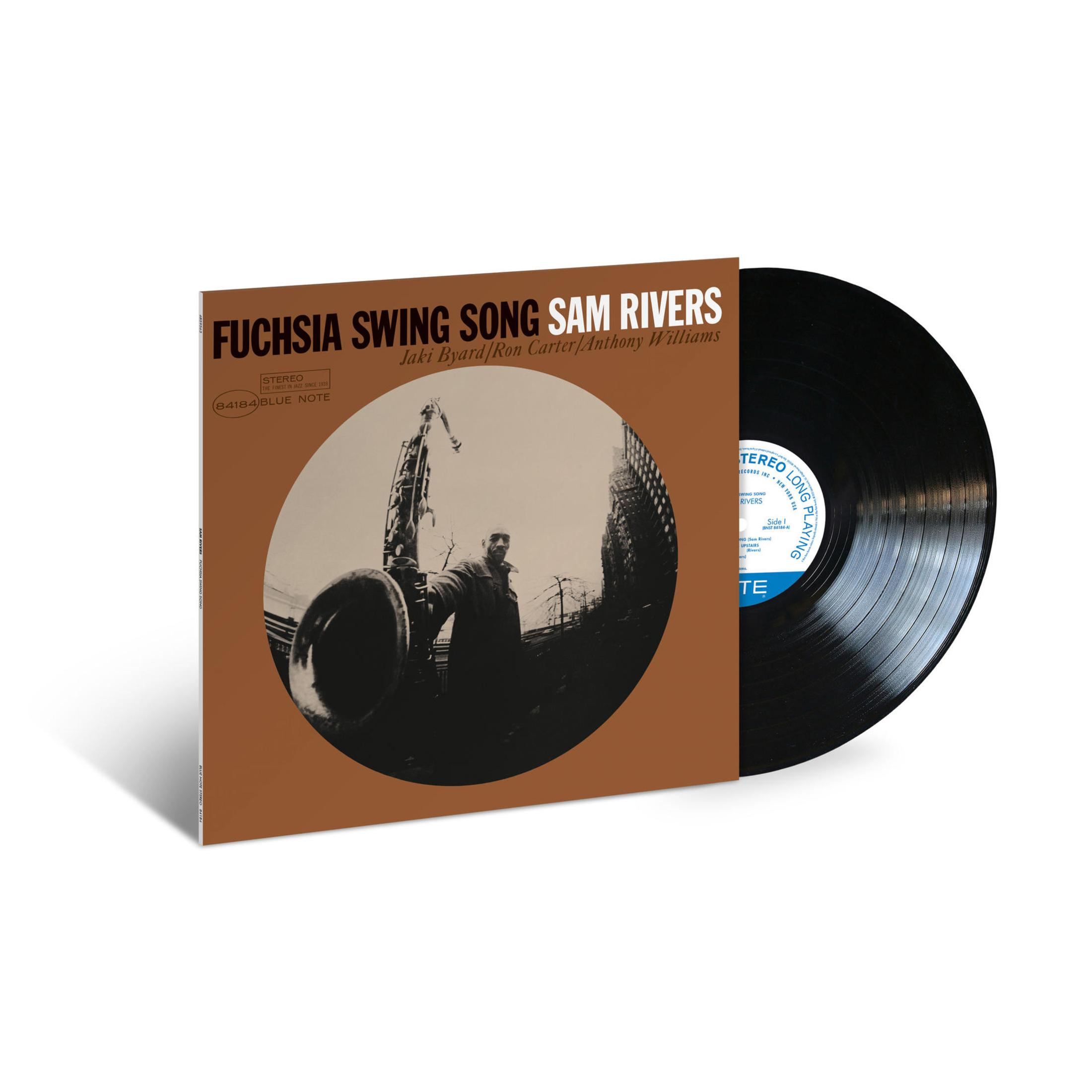 Portada del álbum Fuchsia Swing Song. Un disco de vinilo negro está junto a la portada.