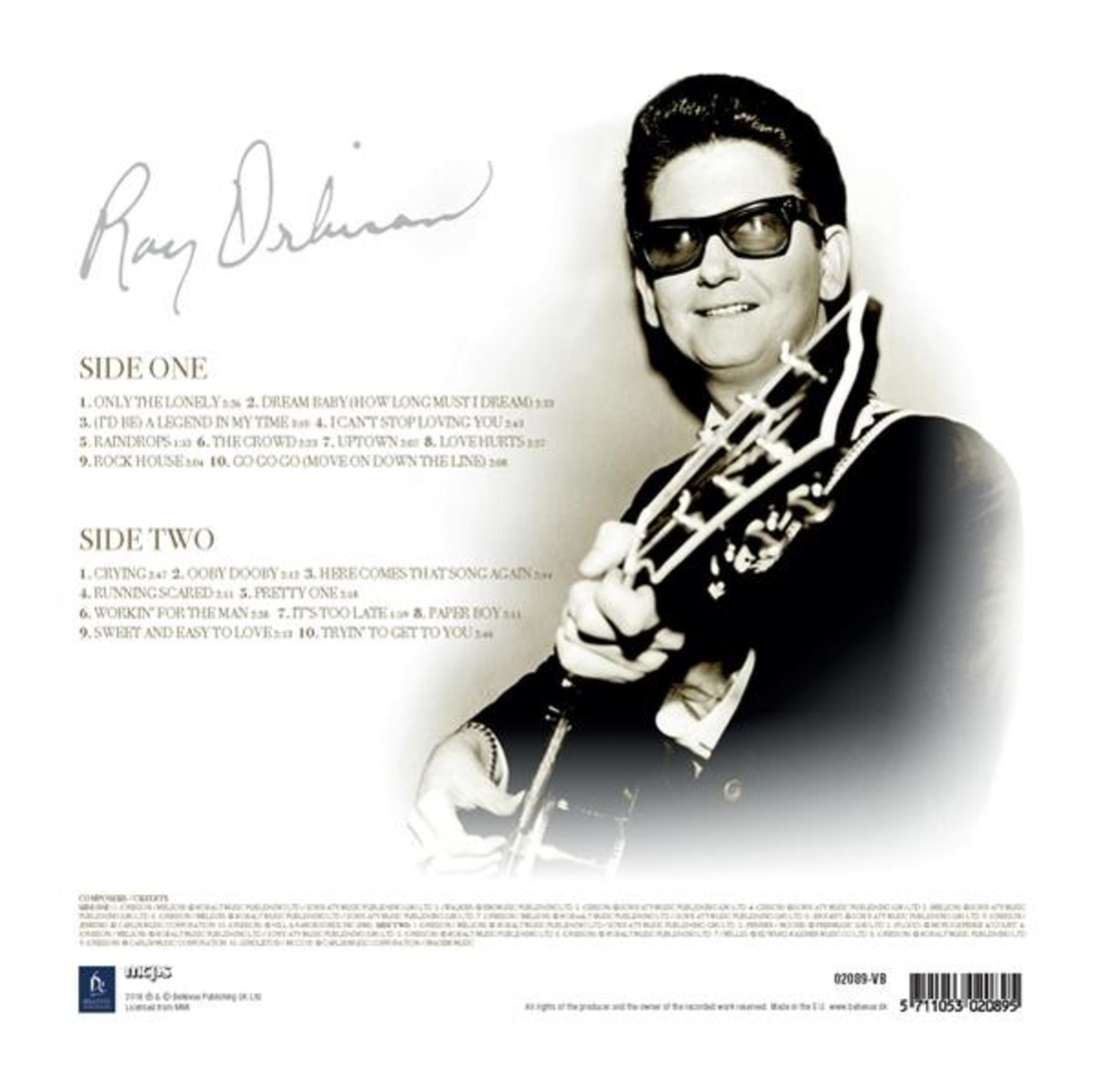 CD back cover: Roy Orbison with a guitar, side one and two track listings and signature.