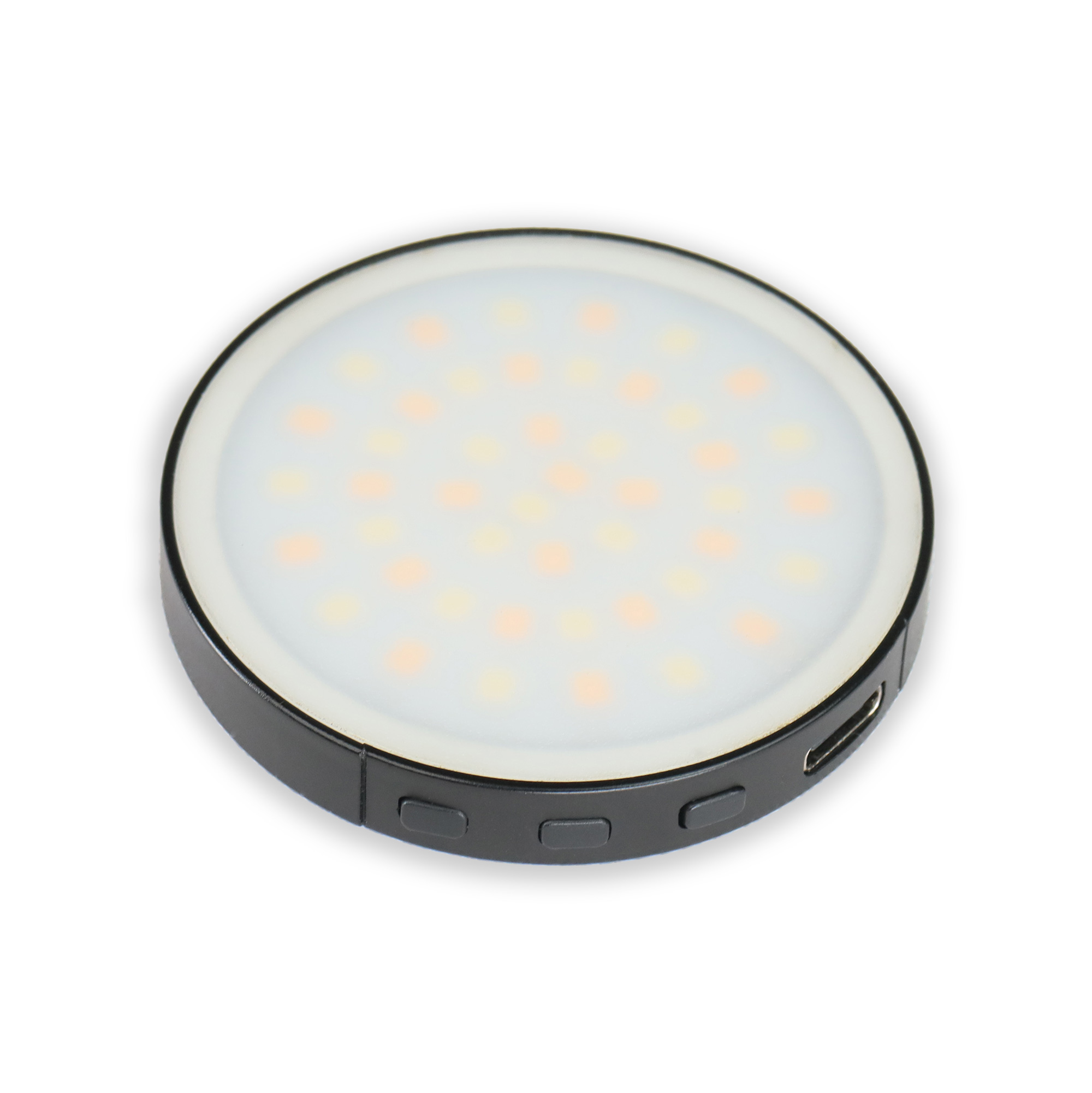 A round, black LED light with a white, illuminated center, isolated on a white background.