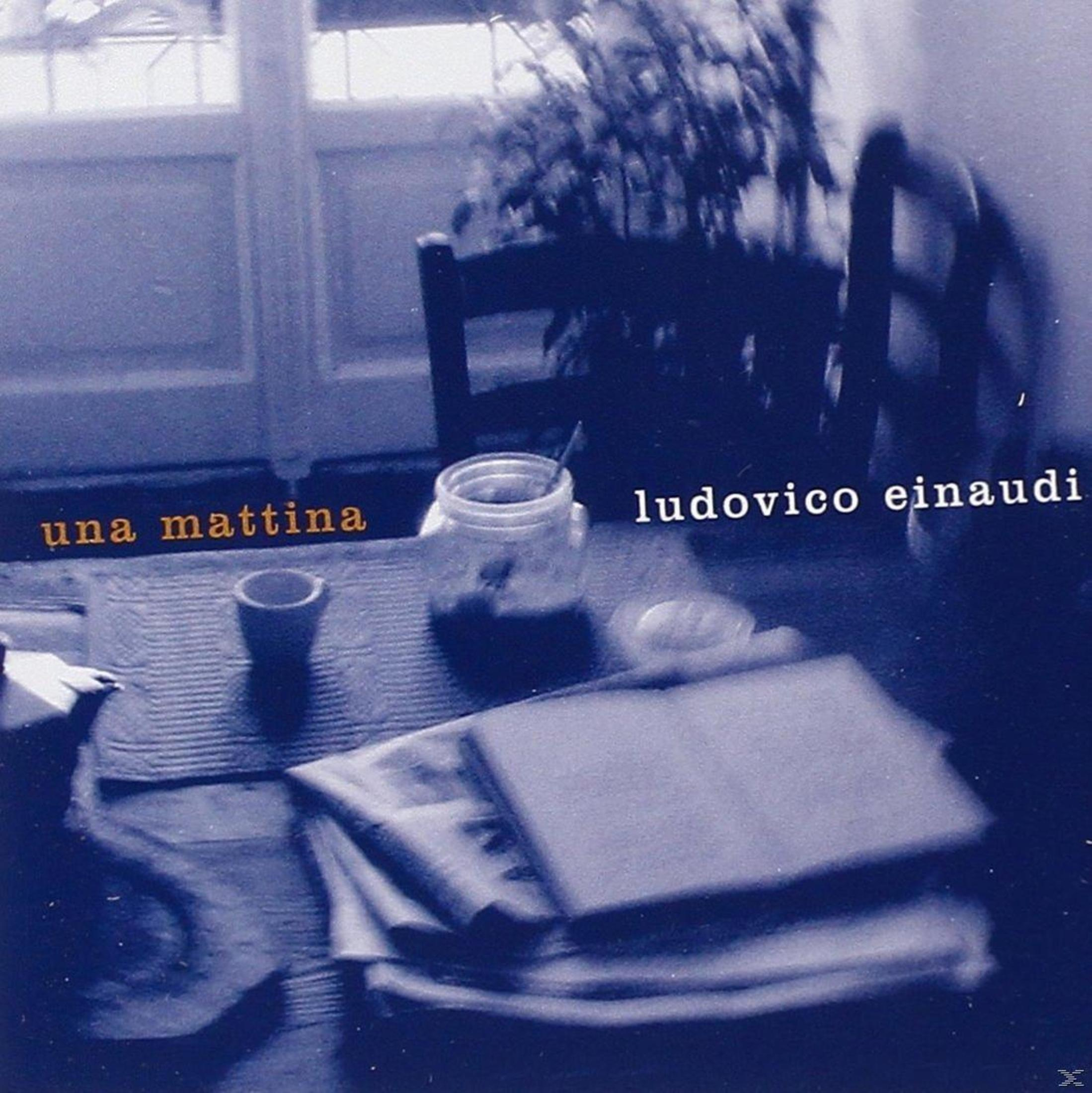 Copertina album con tavolo: tazza, barattolo, libro, testo 'una mattina' e artista 'Ludovico Einaudi'.