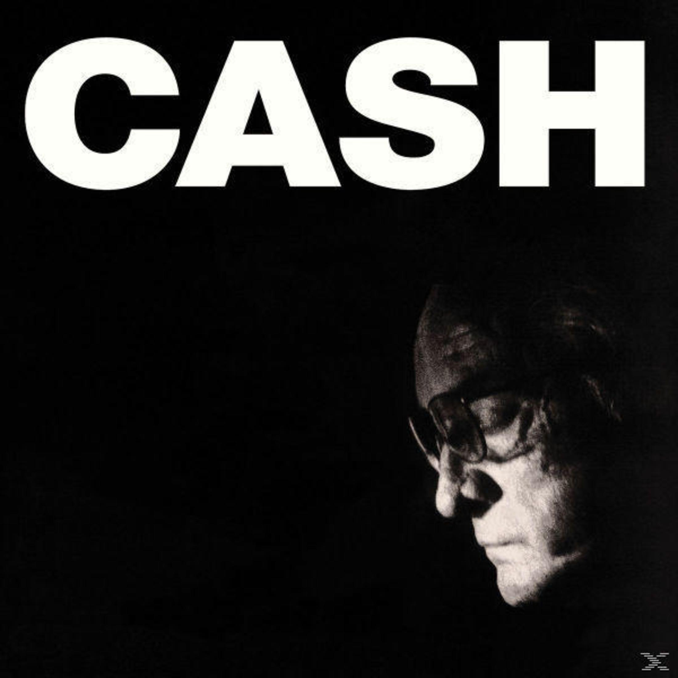 Uomo con occhiali, copertina dell'album con testo 'CASH' su sfondo nero.