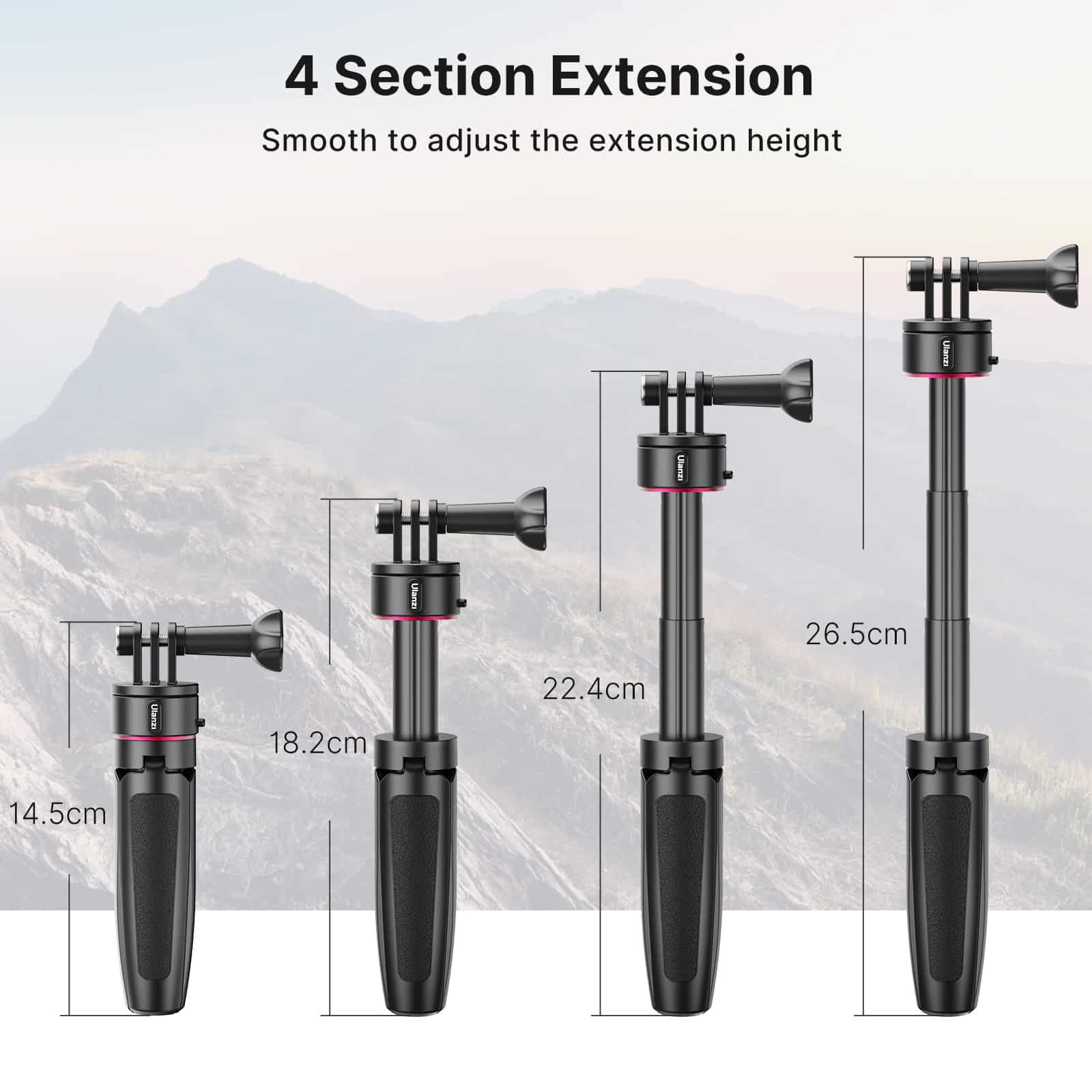 Cztery czarne kijki do selfie na różnych wysokościach, oznaczone pomiarami. Tło to rozmyta sceneria górska.