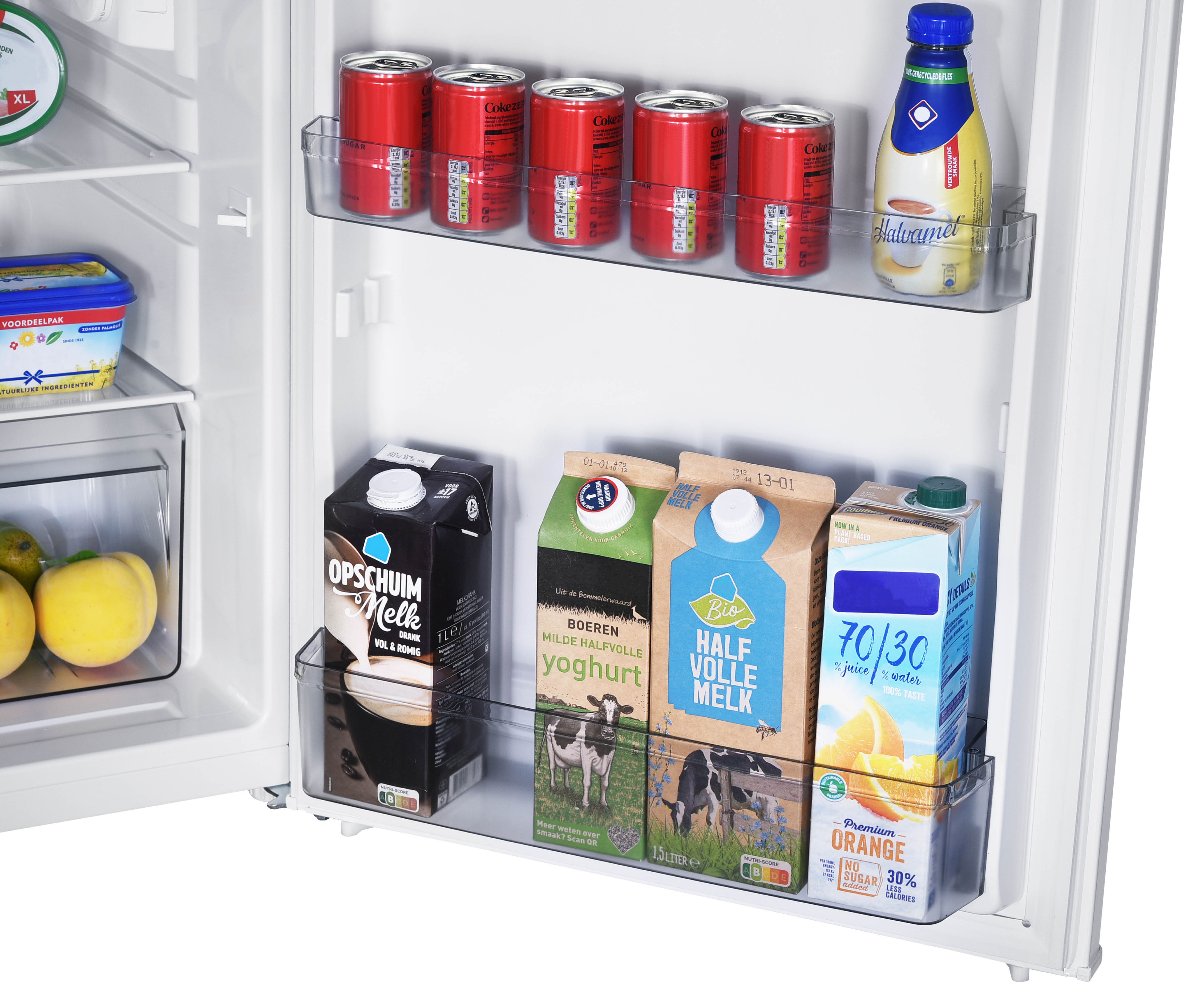 A fridge interior with beverages: cans of Coke, a caramel bottle, and cartons.