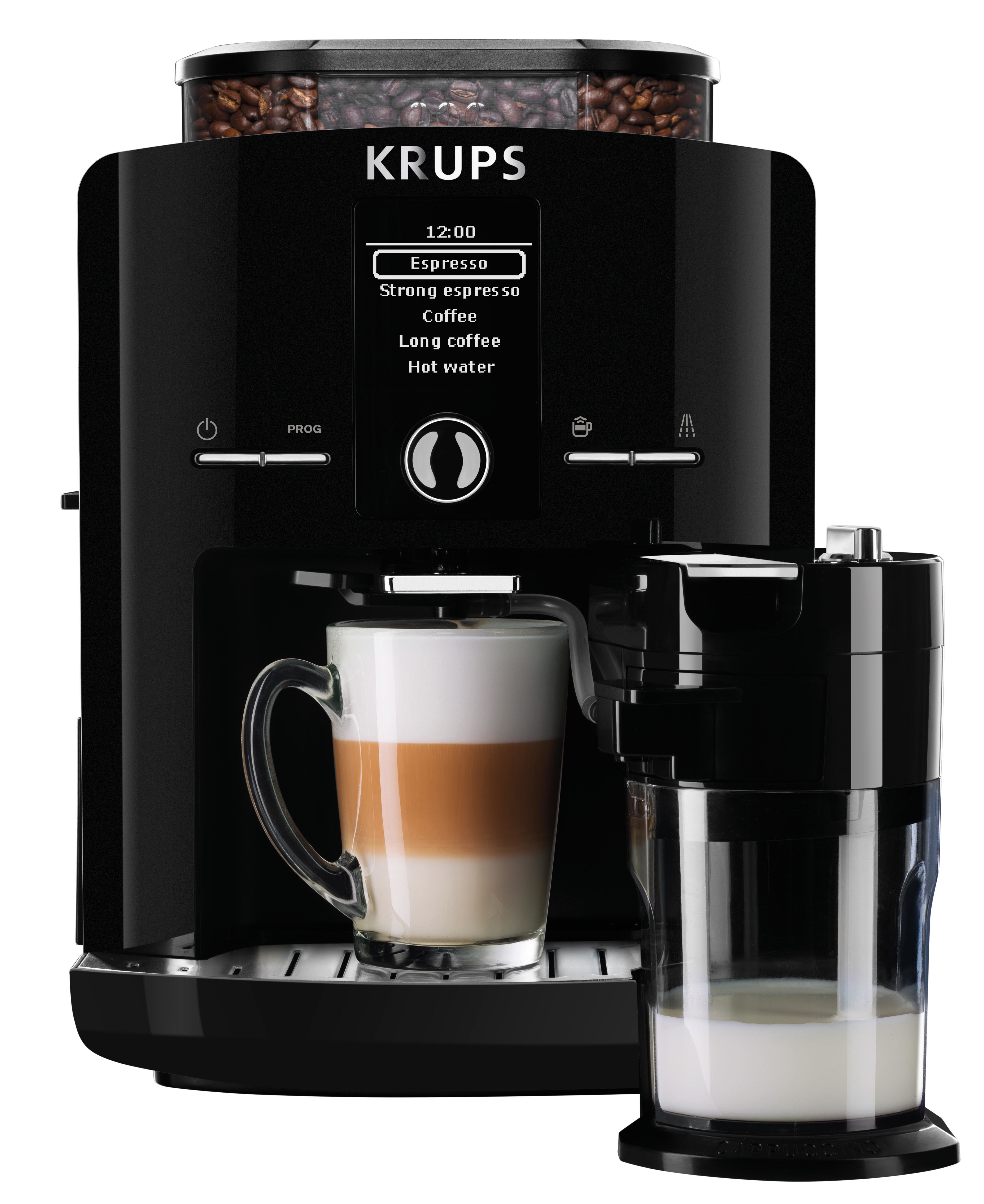 Schwarze KRUPS Kaffeemaschine mit einem Glas Latte Macchiato. Kaffeebohnenbehälter oben.
