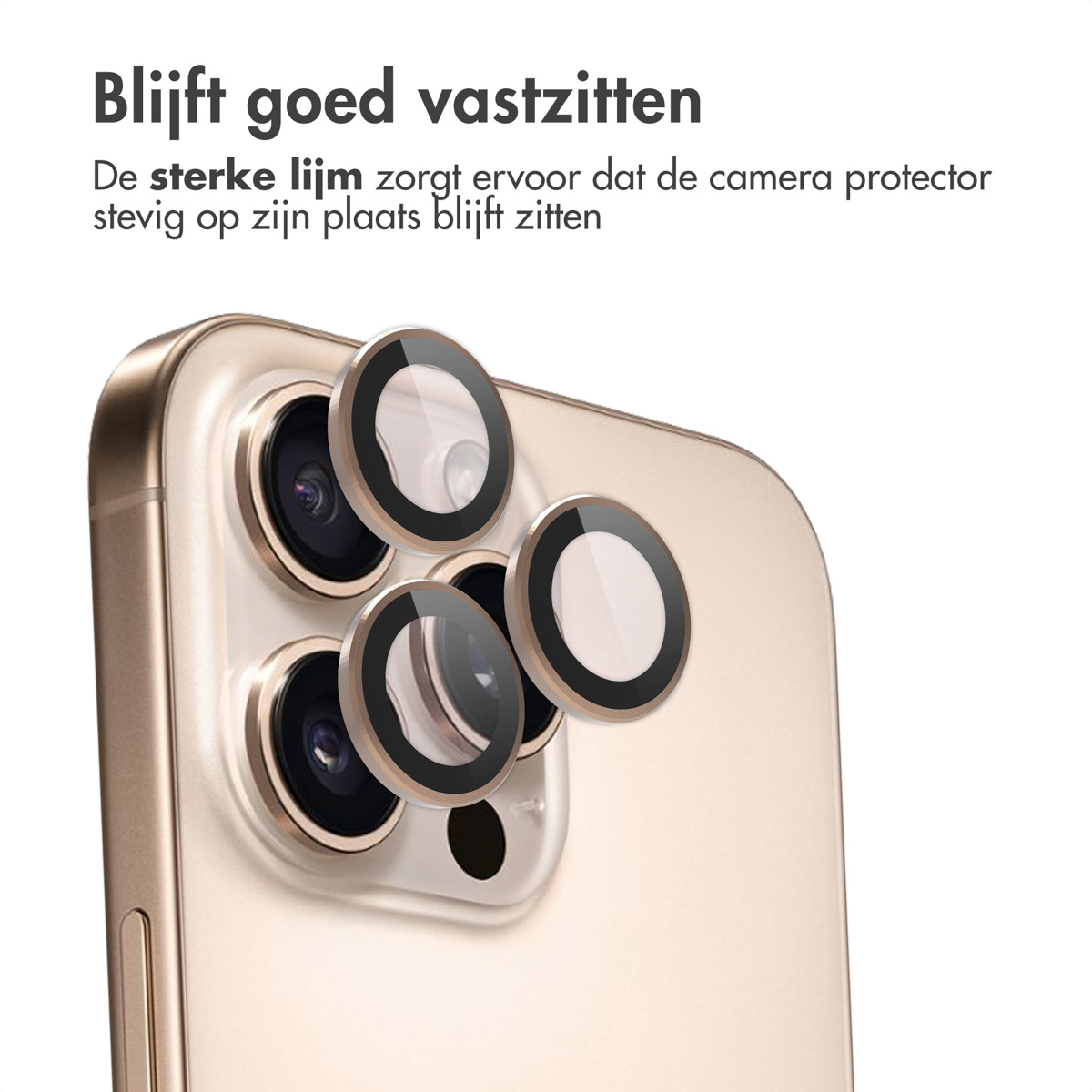 Gros plan d'un téléphone doré avec des protecteurs d'appareil photo. Le texte dit : 'Reste en place'.