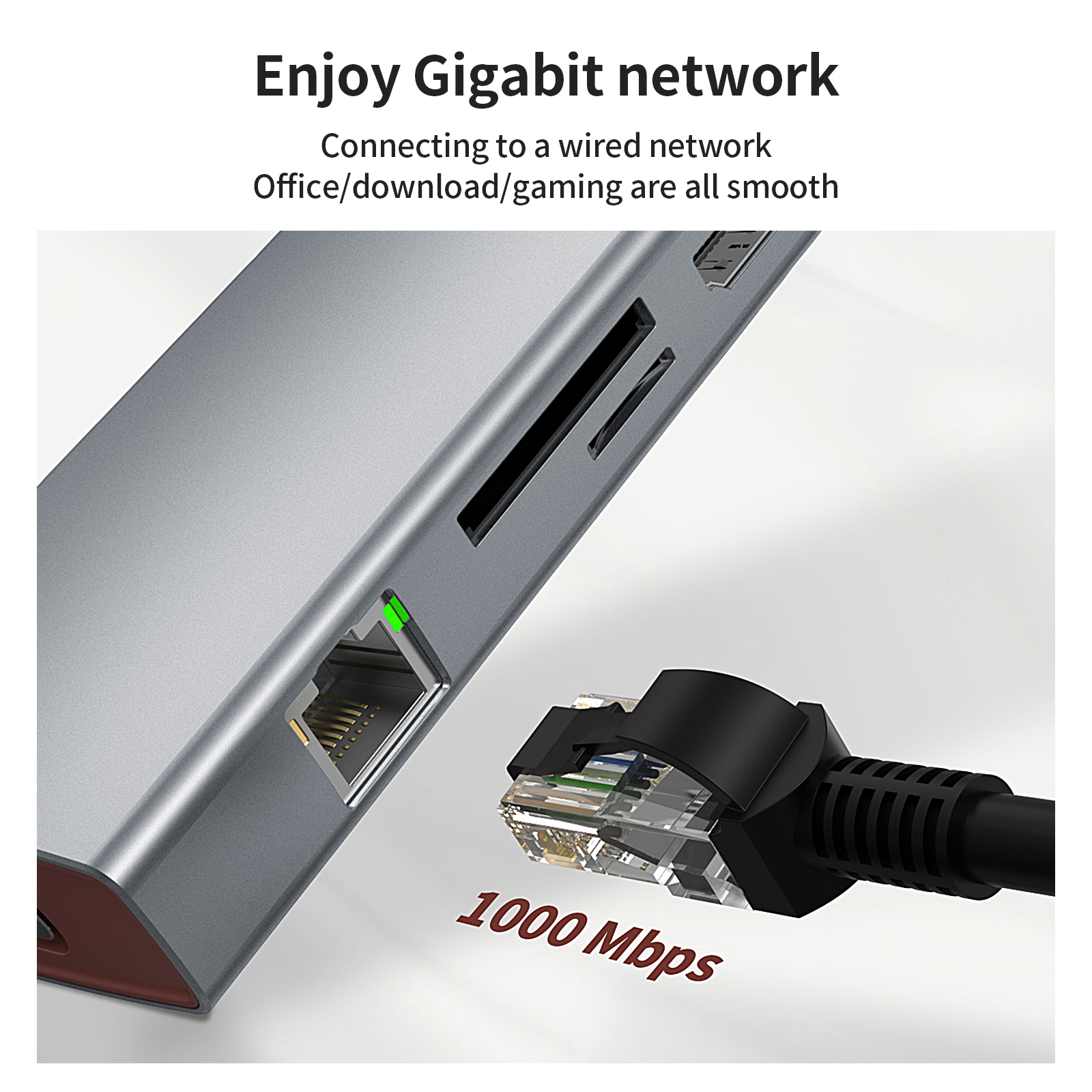 Silberner Hub mit angeschlossenem schwarzem Kabel. Text: Enjoy Gigabit network, 1000 Mbps.
