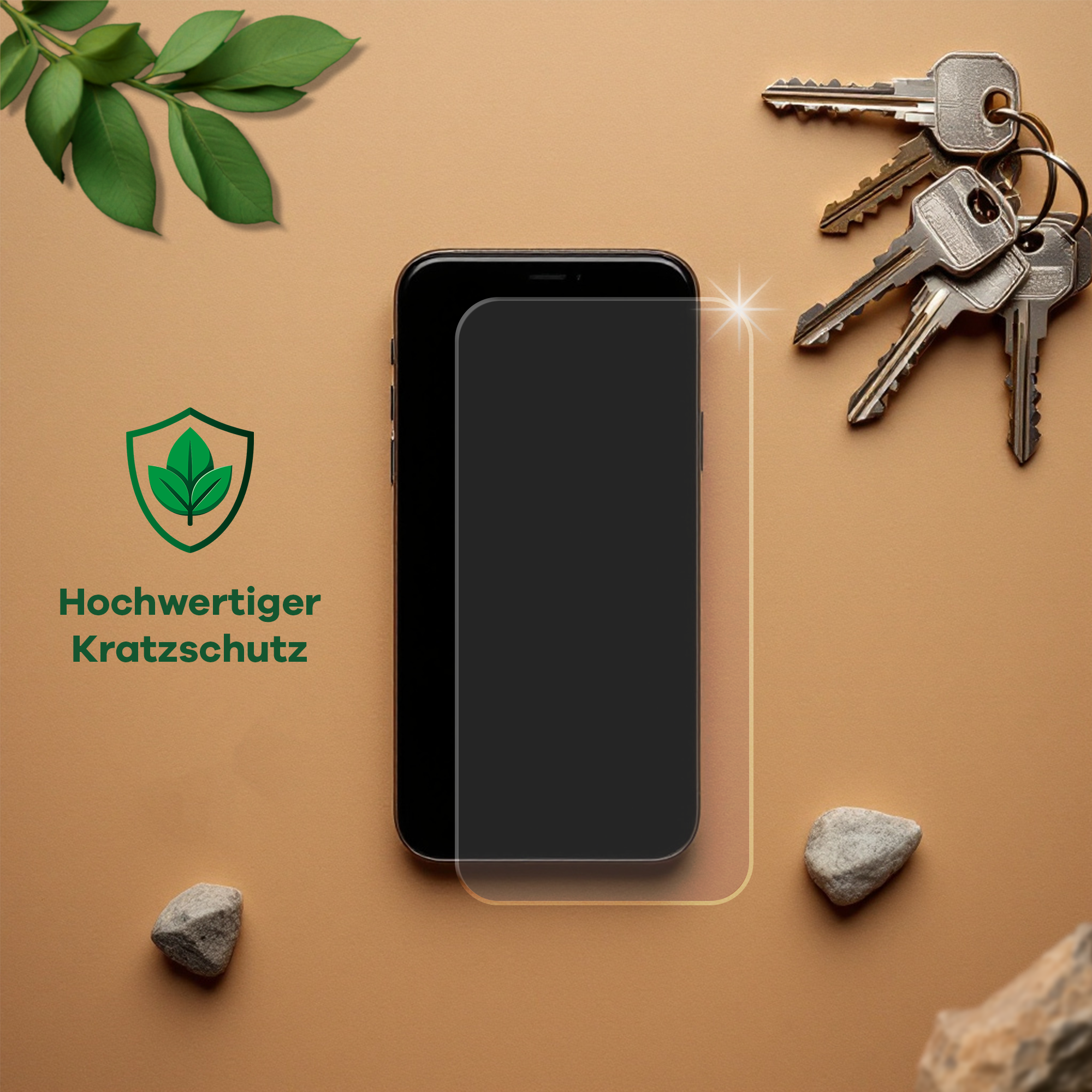 Ein Telefon mit Displayschutz, Schlüsseln und Steinen auf beigem Untergrund. Schutzlogo sichtbar.