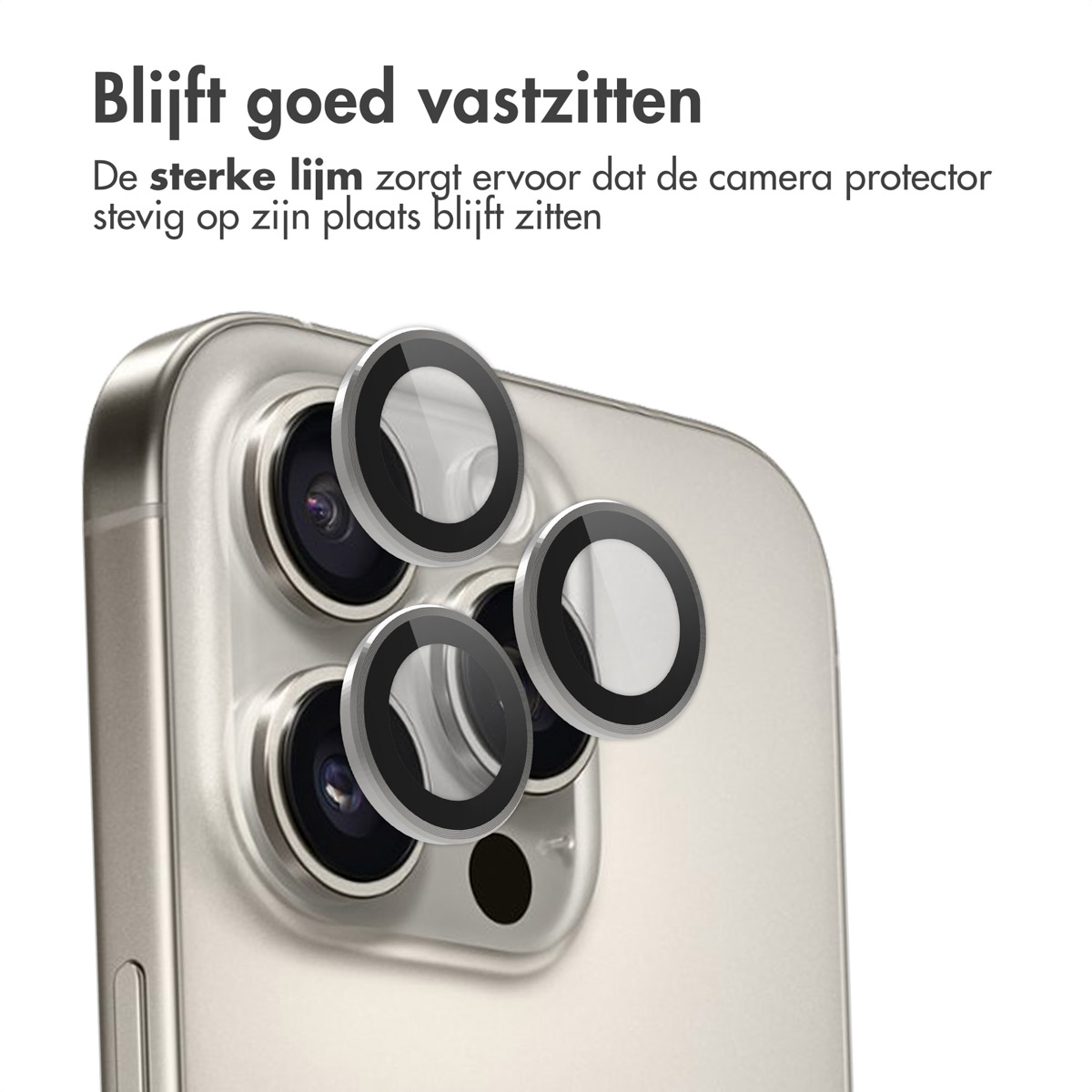 Gros plan d'un téléphone doré avec des protecteurs d'appareil photo. Le texte dit : 'Reste en place'.