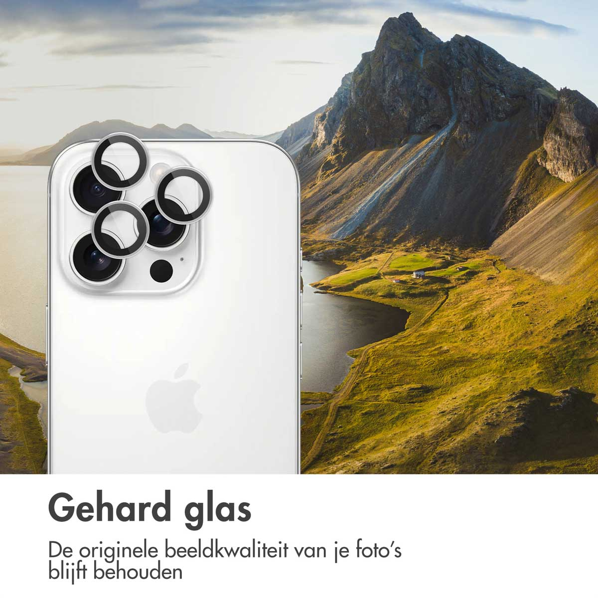 Un téléphone avec des protections d'objectif sur un arrière-plan panoramique avec une montagne et un lac.