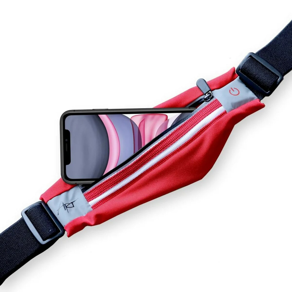 Marsupio rosso con un telefono dentro. Cerniera e cinturino bianchi. Cinghie nere su entrambi i lati.