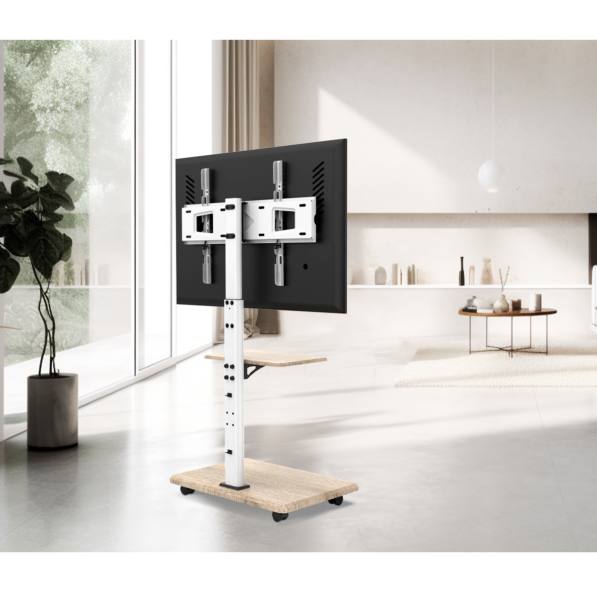 Een moderne tv-standaard met een gemonteerde tv in een lichte, ruime woonkamer.