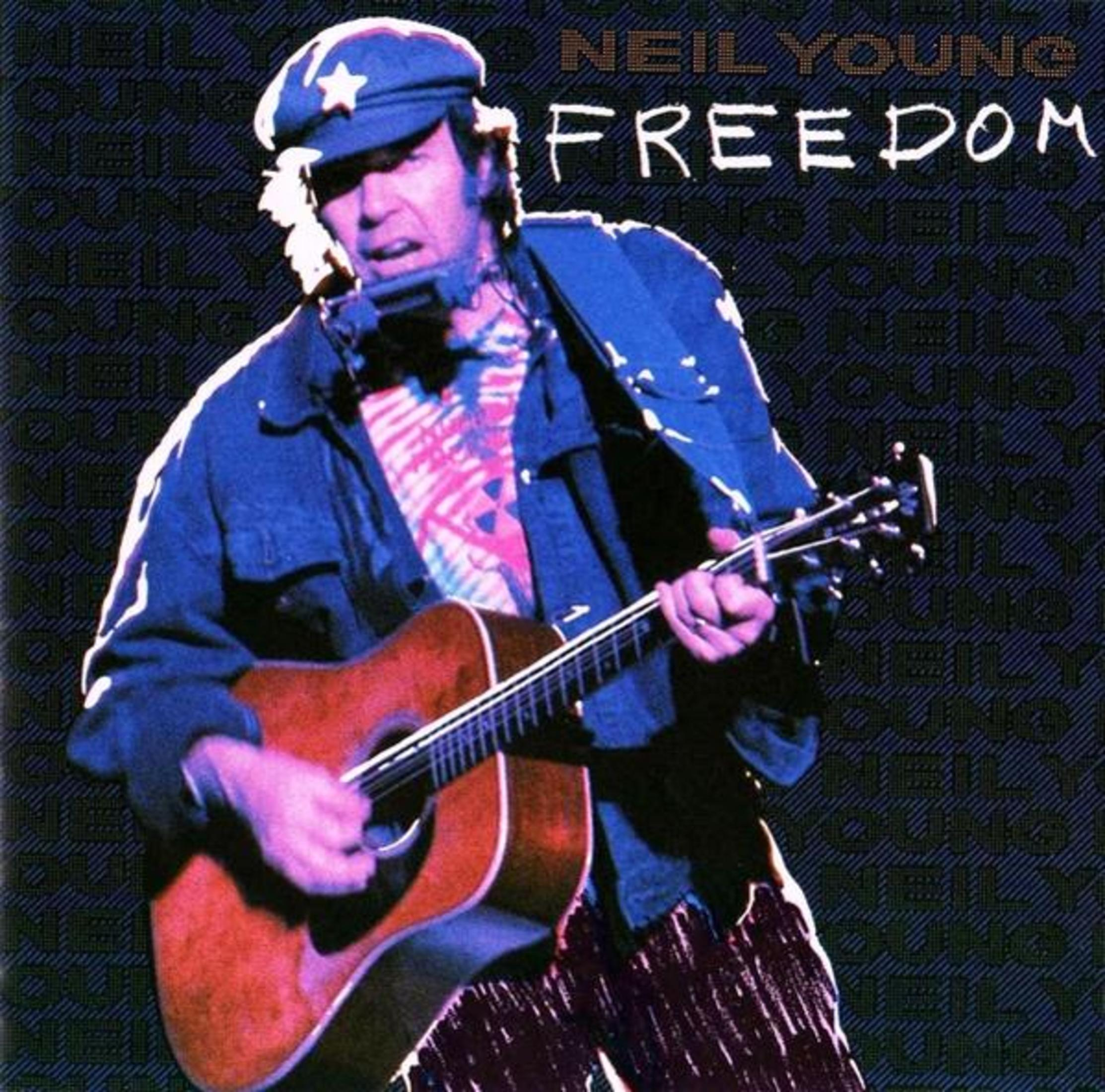 Neil Young tocando la guitarra, portada del álbum con el título 'Freedom'.