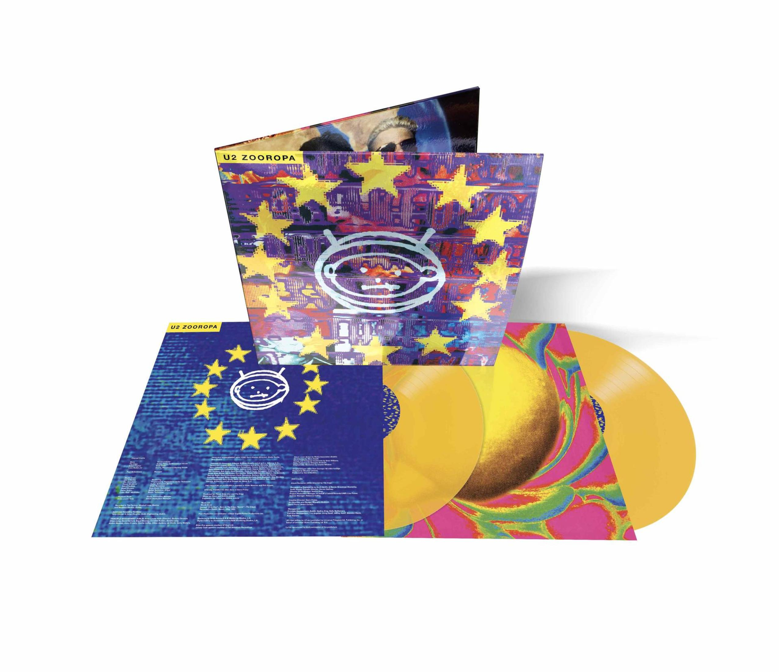 Portada del álbum con varios discos de vinilo. La portada es azul con estrellas amarillas. Discos amarillos visibles.