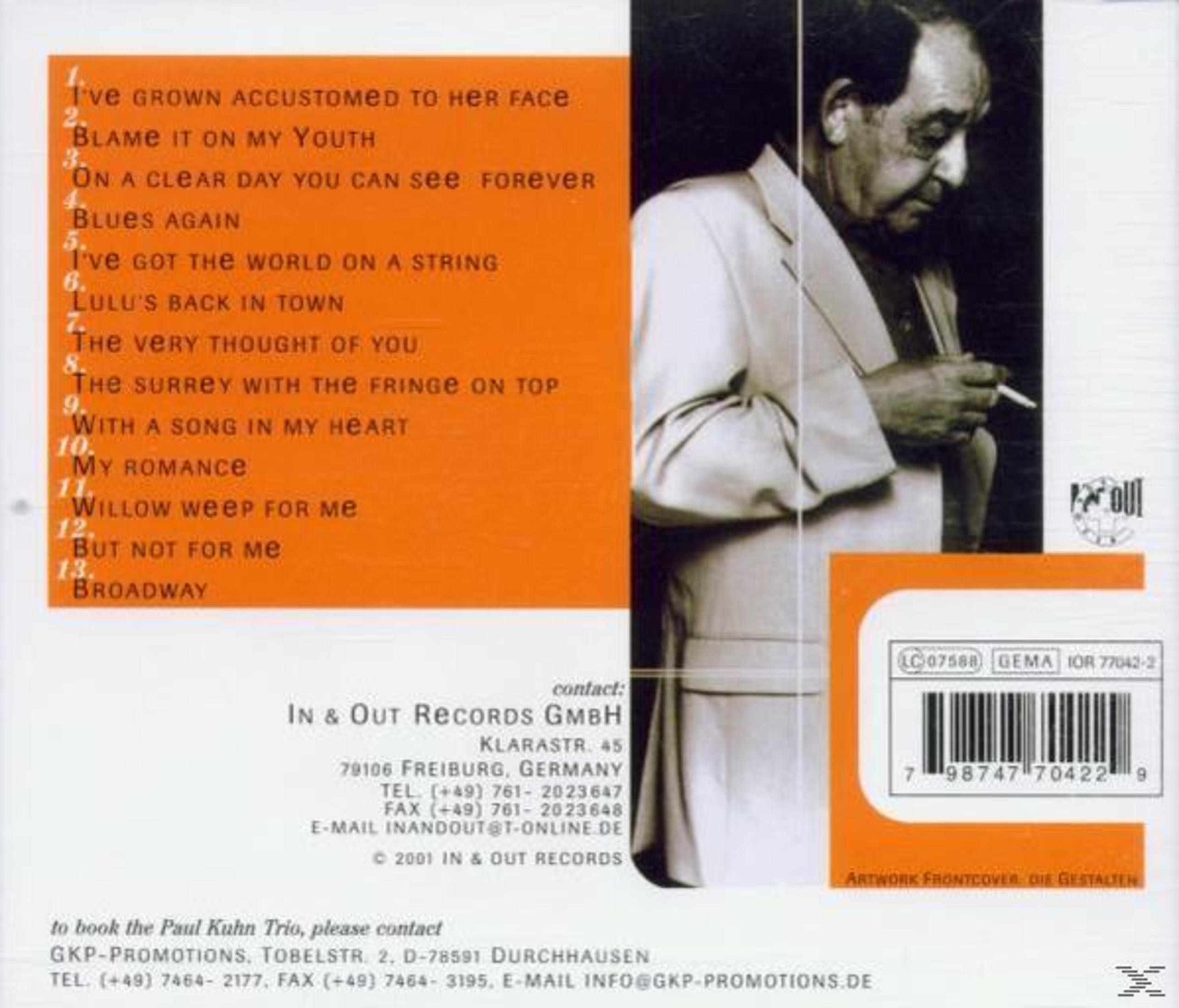 Dos d'un album. Un homme en chemise blanche tient une cigarette. Texte et liste des titres visibles.