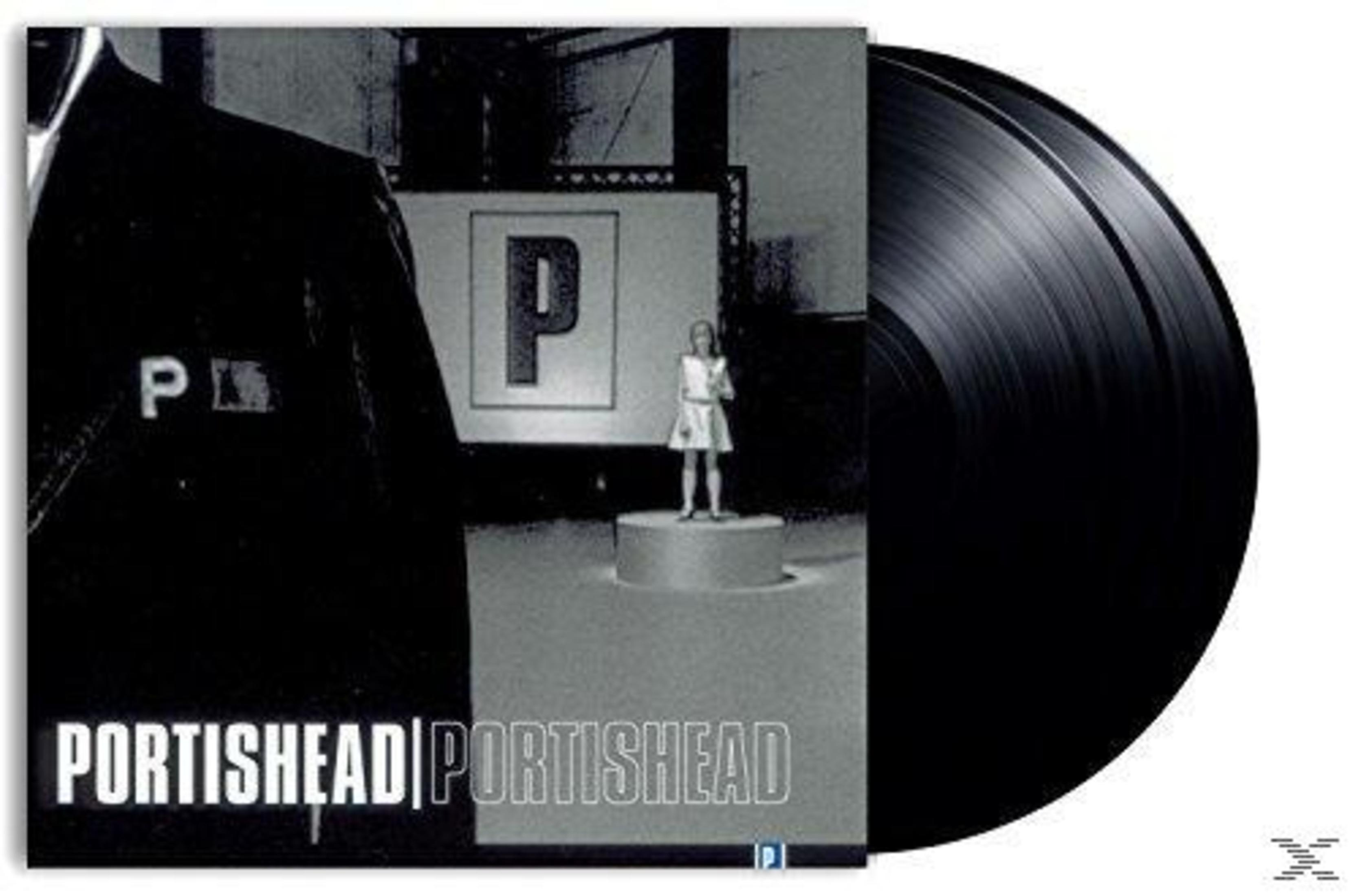 Copertina dell'album dei Portishead con un'immagine in bianco e nero di una persona e una figura. È visibile un disco in vinile nero.