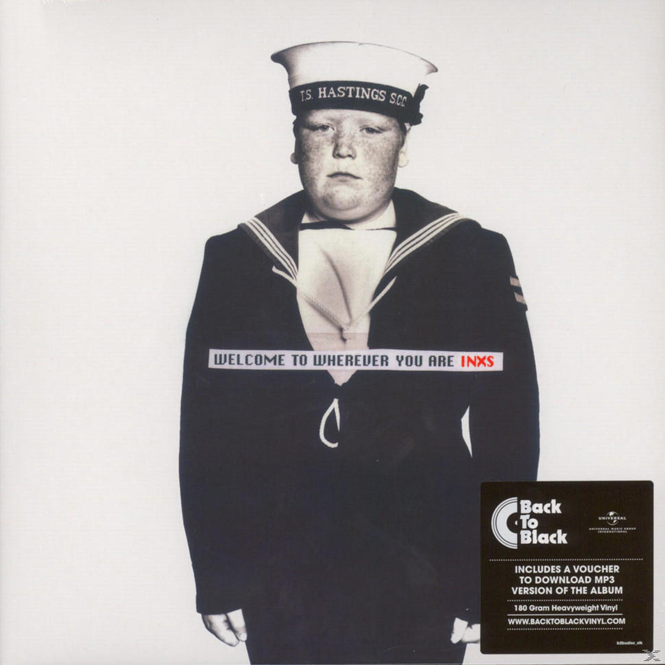 INXS albumhoes met een man in een matrozenoutfit met de naam van de band.