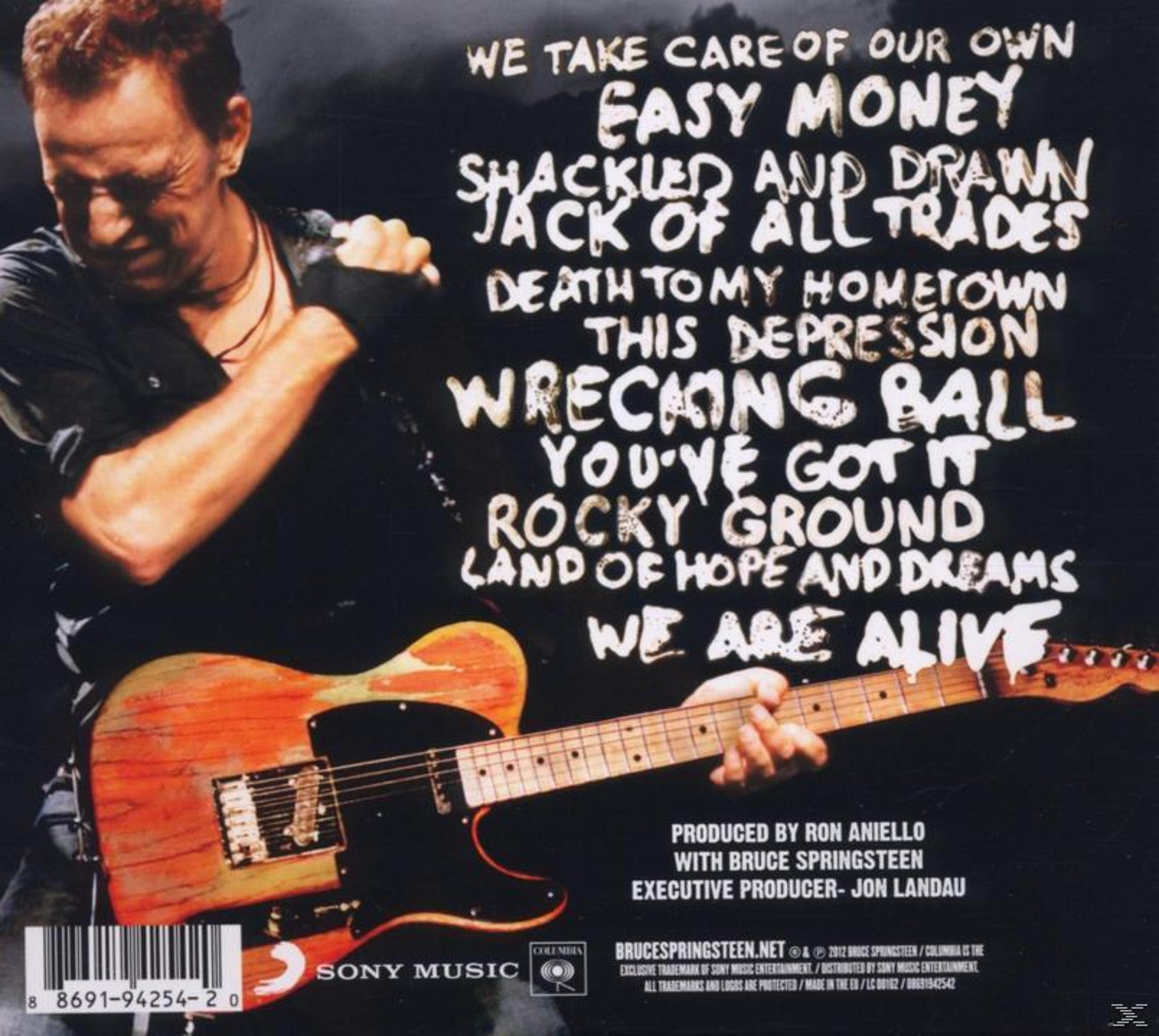 Albumhoes, Bruce Springsteen houdt een gitaar vast op het podium. Tekst met songtitels links.