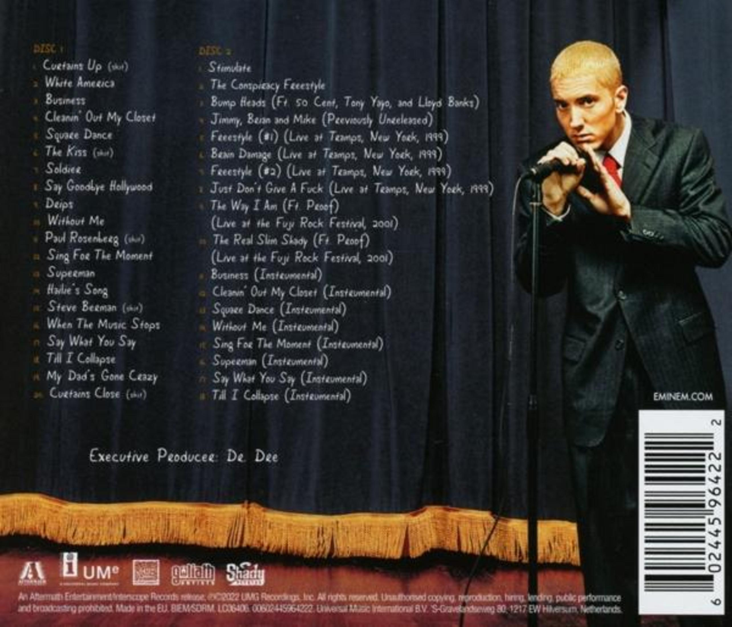 Back of an album with Eminem on the right, looking at the camera, and the tracklist on the left.