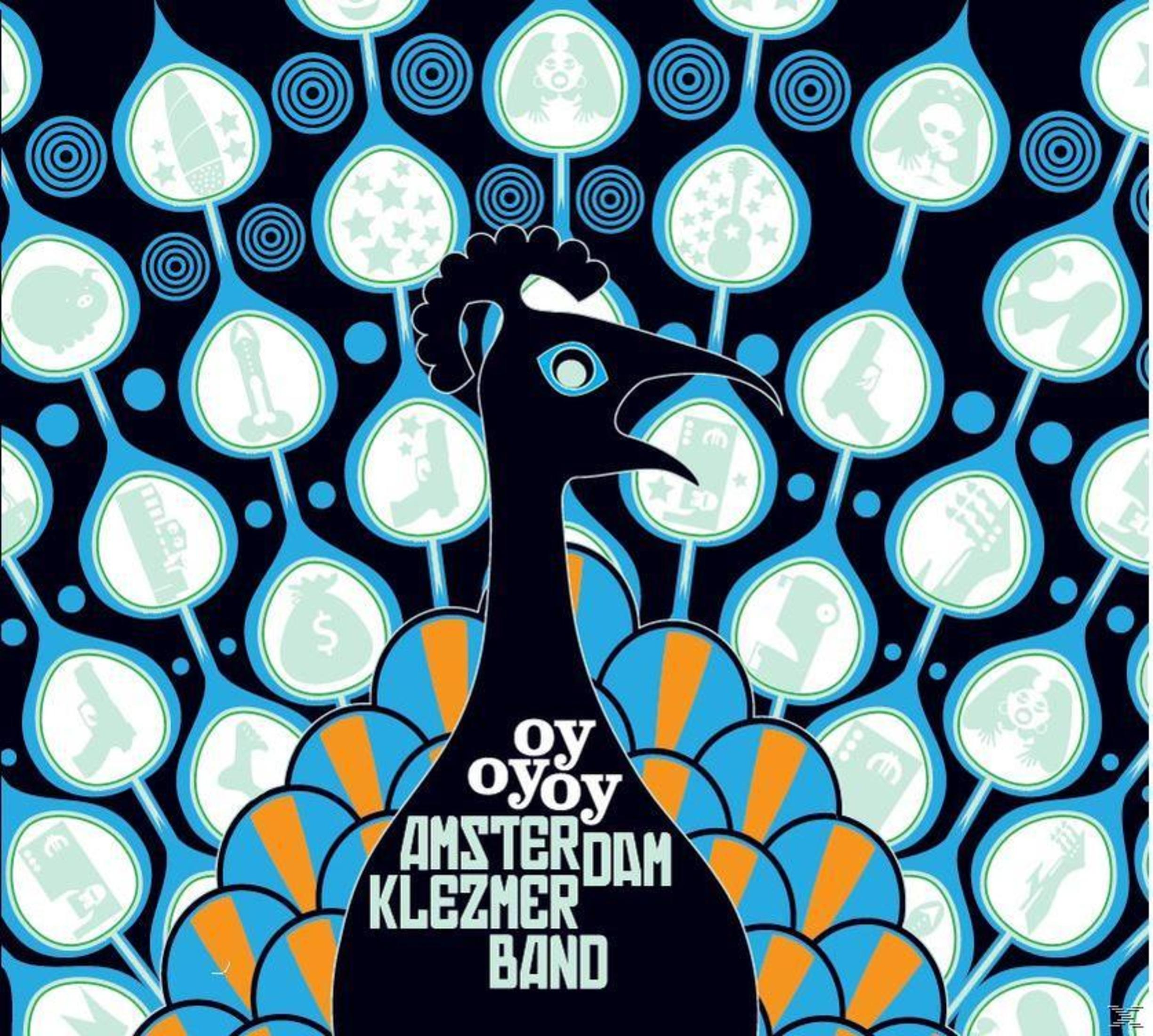 Pochette d'album : Motif de paon avec le texte « oy oy Amsterdam Klezmer Band » sur fond bleu.