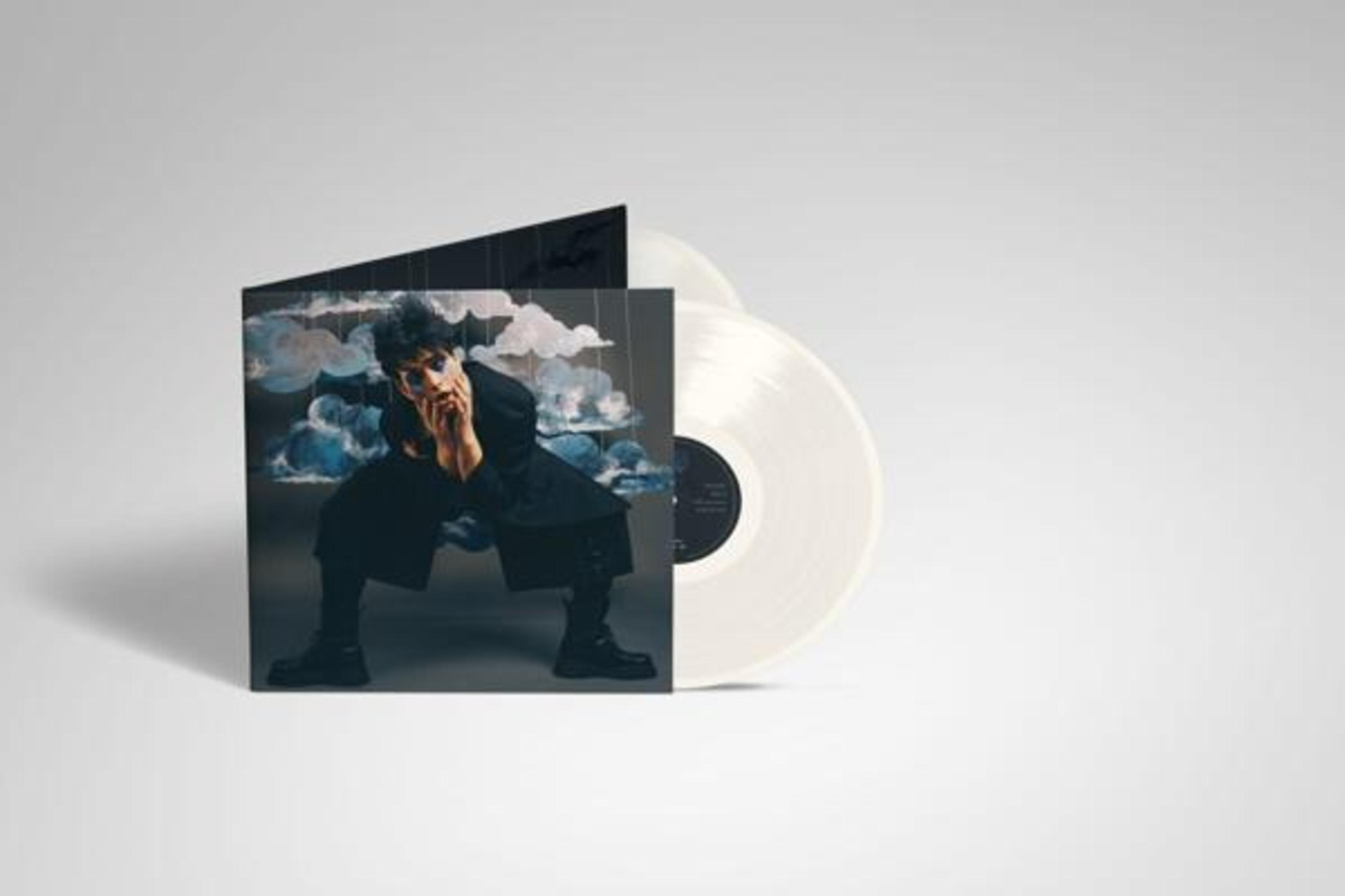 Copertina dell'album con una persona, un disco in vinile e arte.