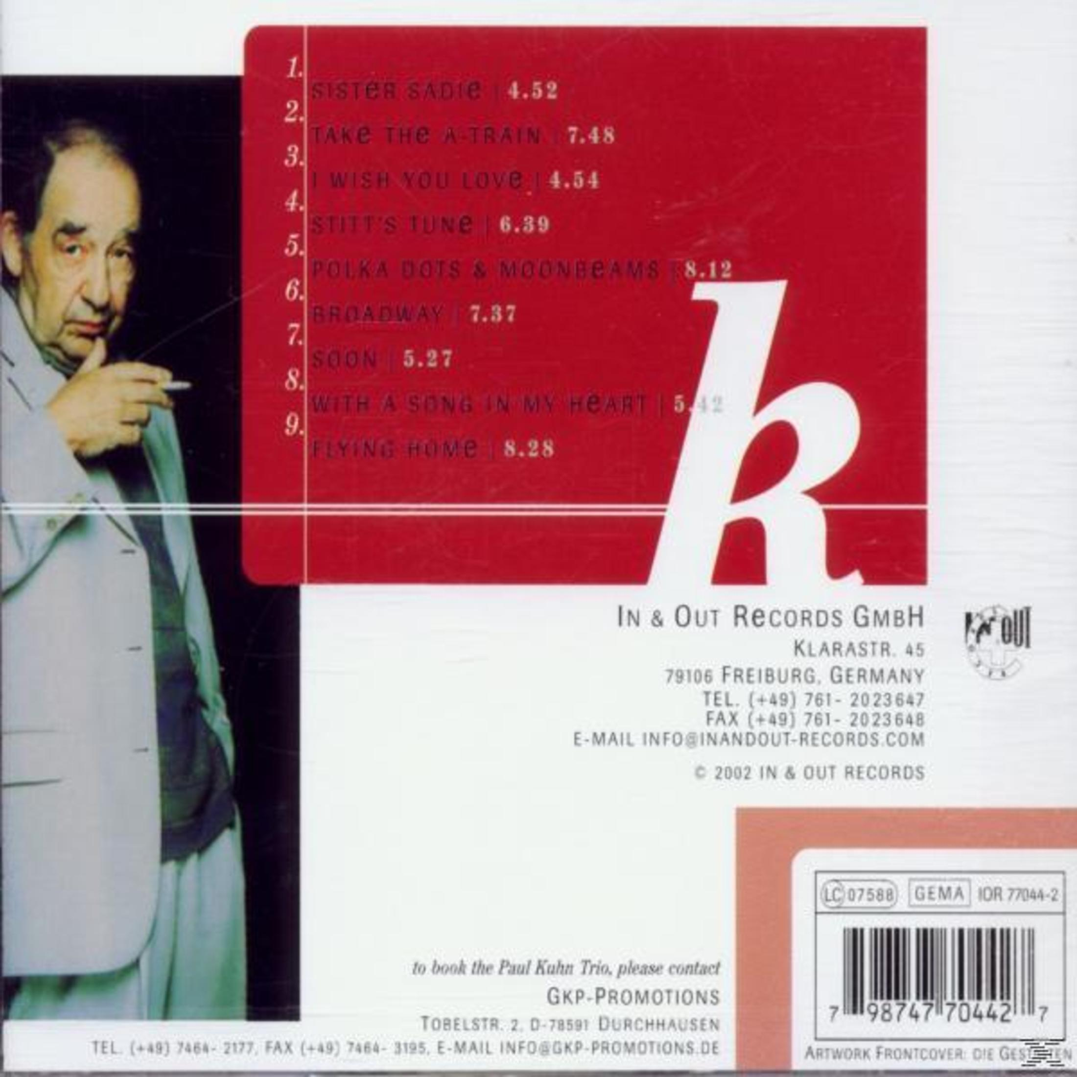 Achterkant van het album met een man, songtitels en de tekst 'In & Out Records'.