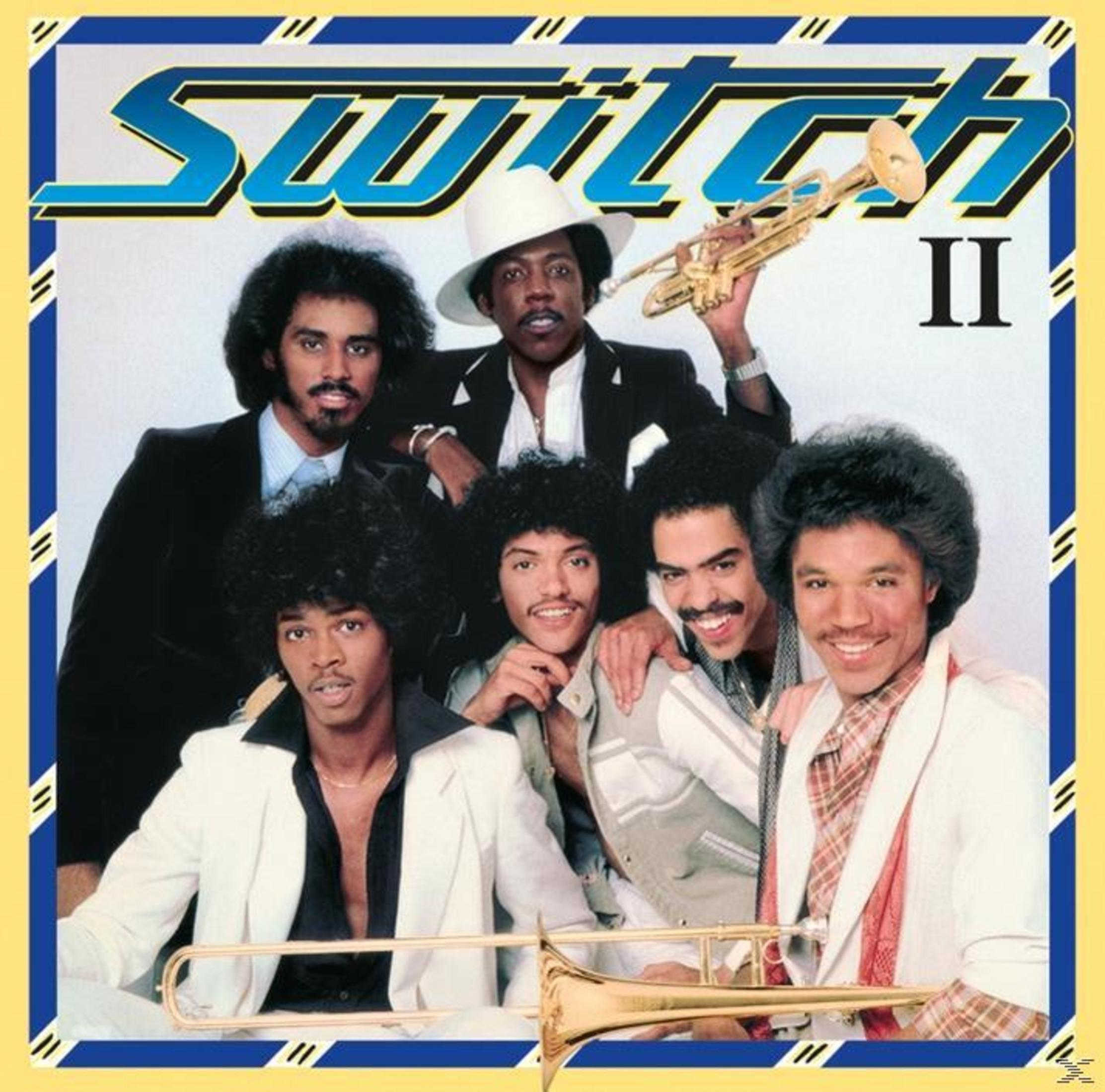 Pochette de l'album Switch II. Présente un groupe d'hommes en tenues variées, l'un tenant une trompette.