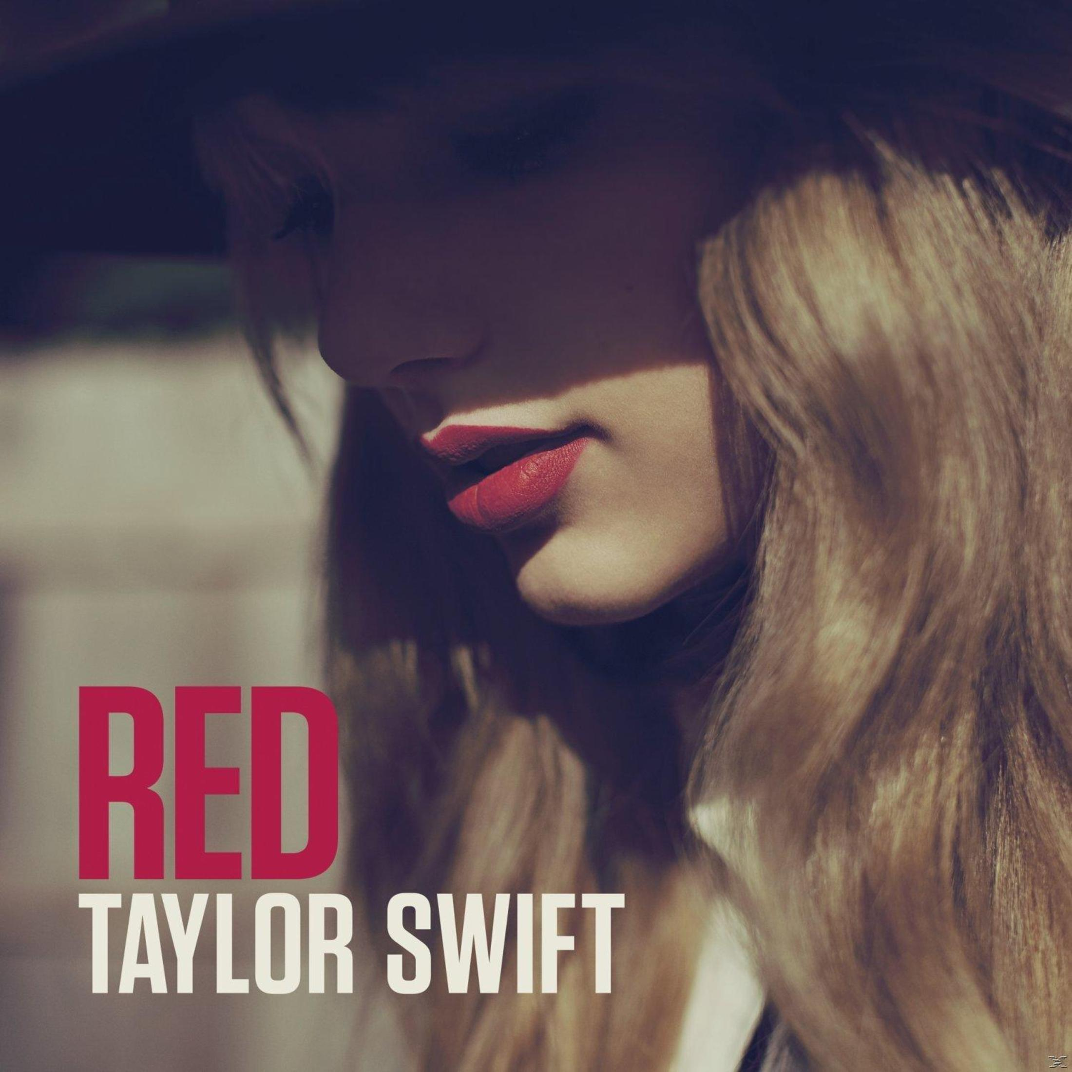 Portada del álbum: Primer plano del rostro de Taylor Swift, labial rojo, cabello rubio, texto 'RED'.