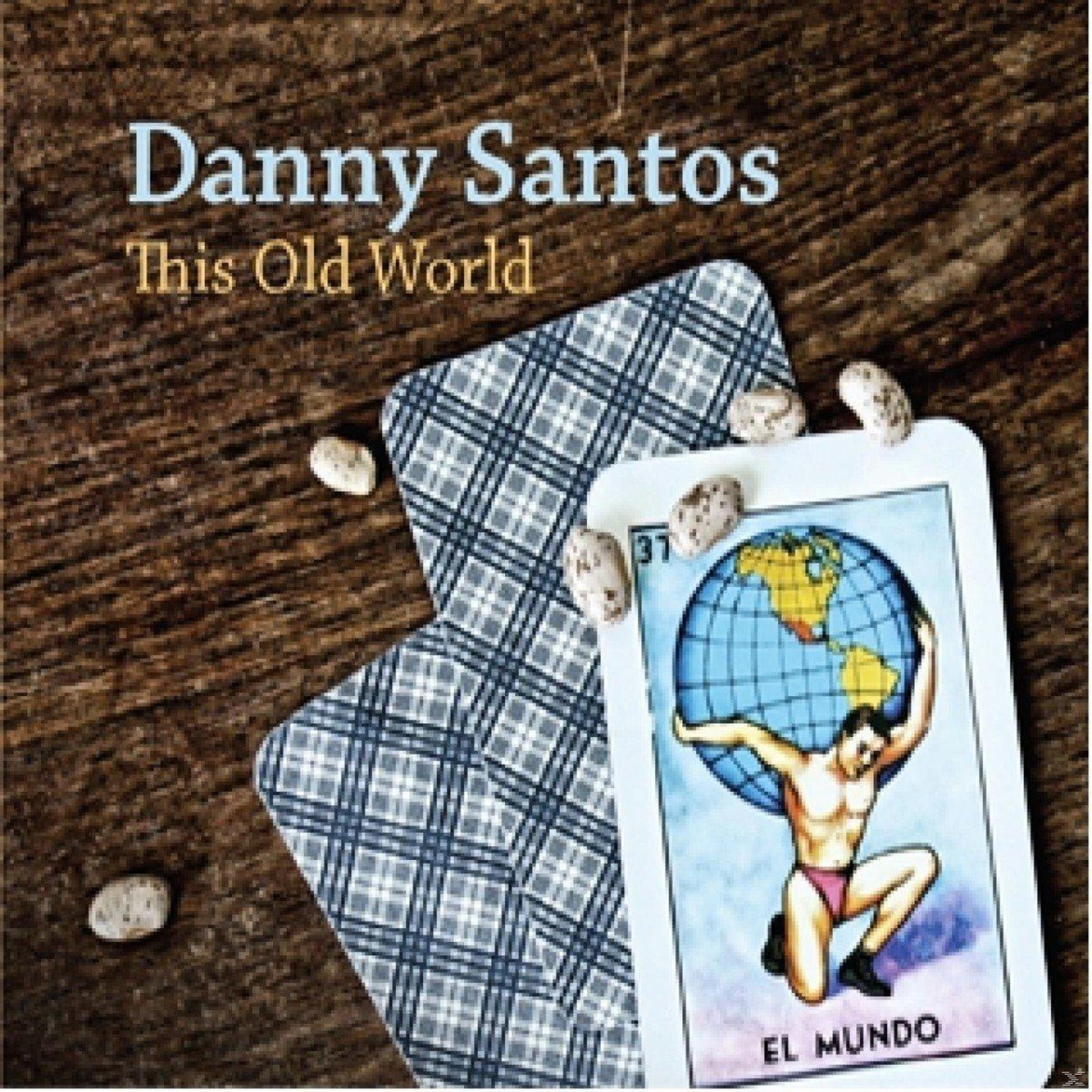 Pochette d'album avec des cartes de tarot et des haricots. Comprend un homme tenant un globe.