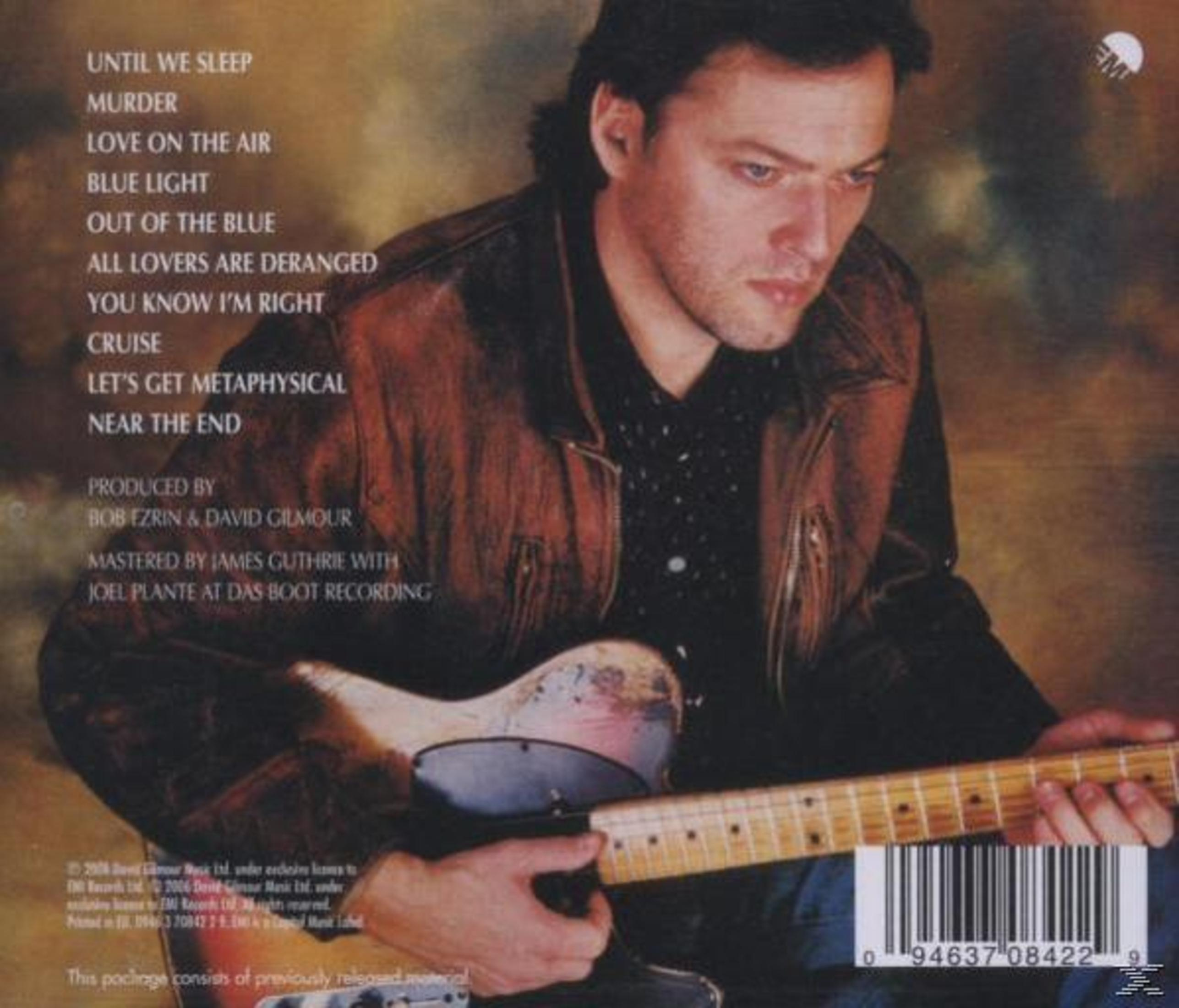Dos de l'album avec un homme jouant de la guitare. Texte : David Gilmour.