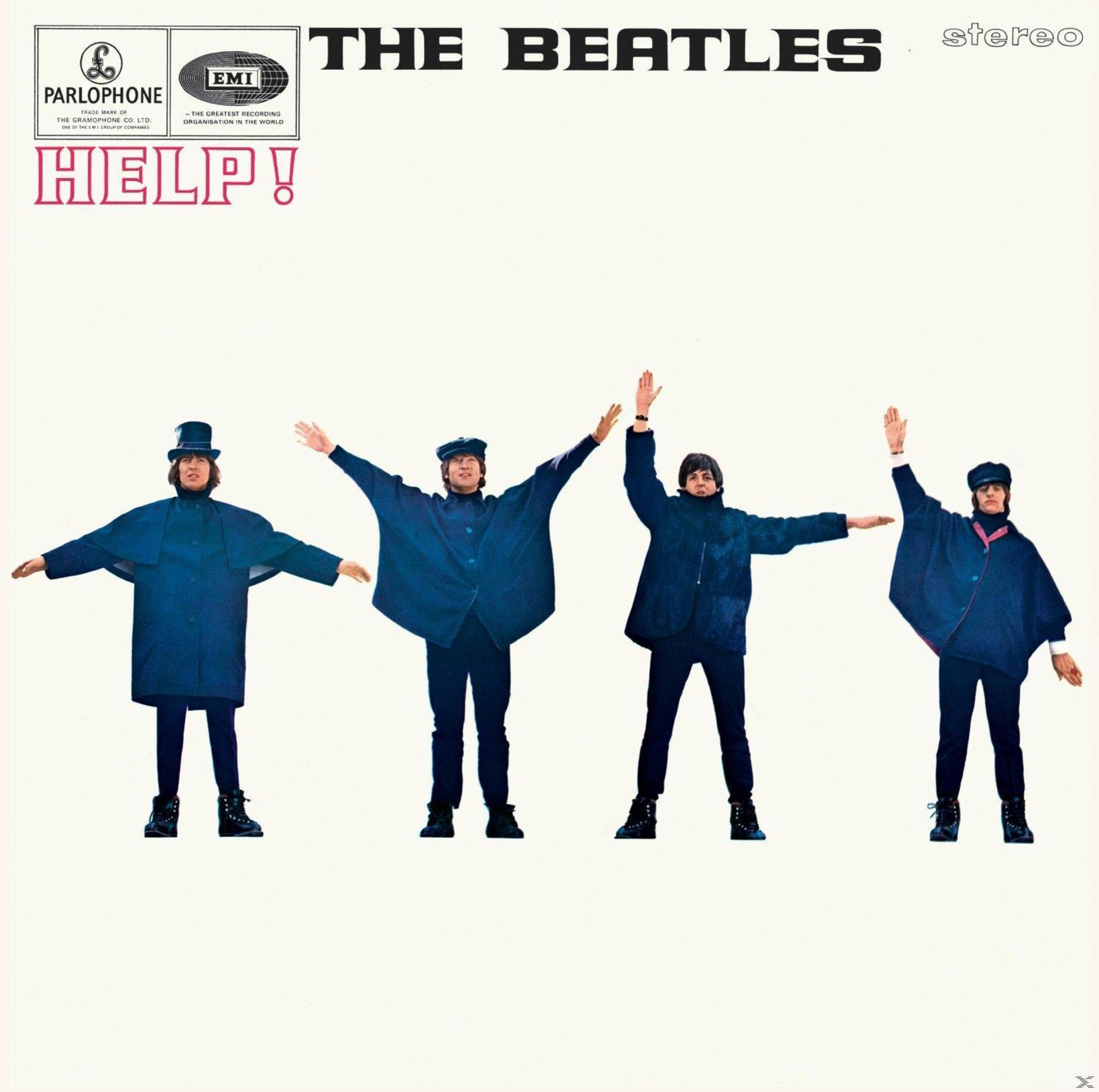 Copertina dell'album: I Beatles, quattro uomini con le braccia alzate, in piedi su sfondo bianco.