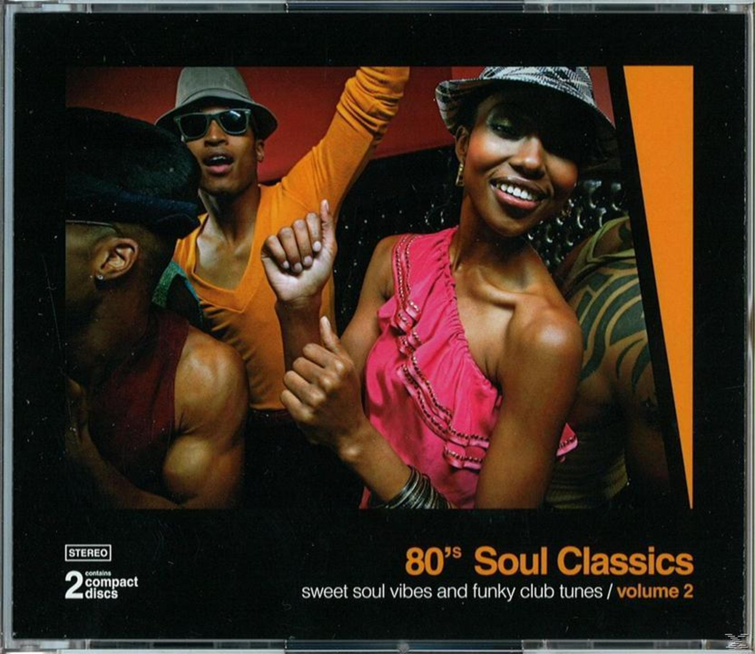Pochette d'album avec un groupe de personnes dansant. Tons orange et noir. Titre '80's Soul Classics'.