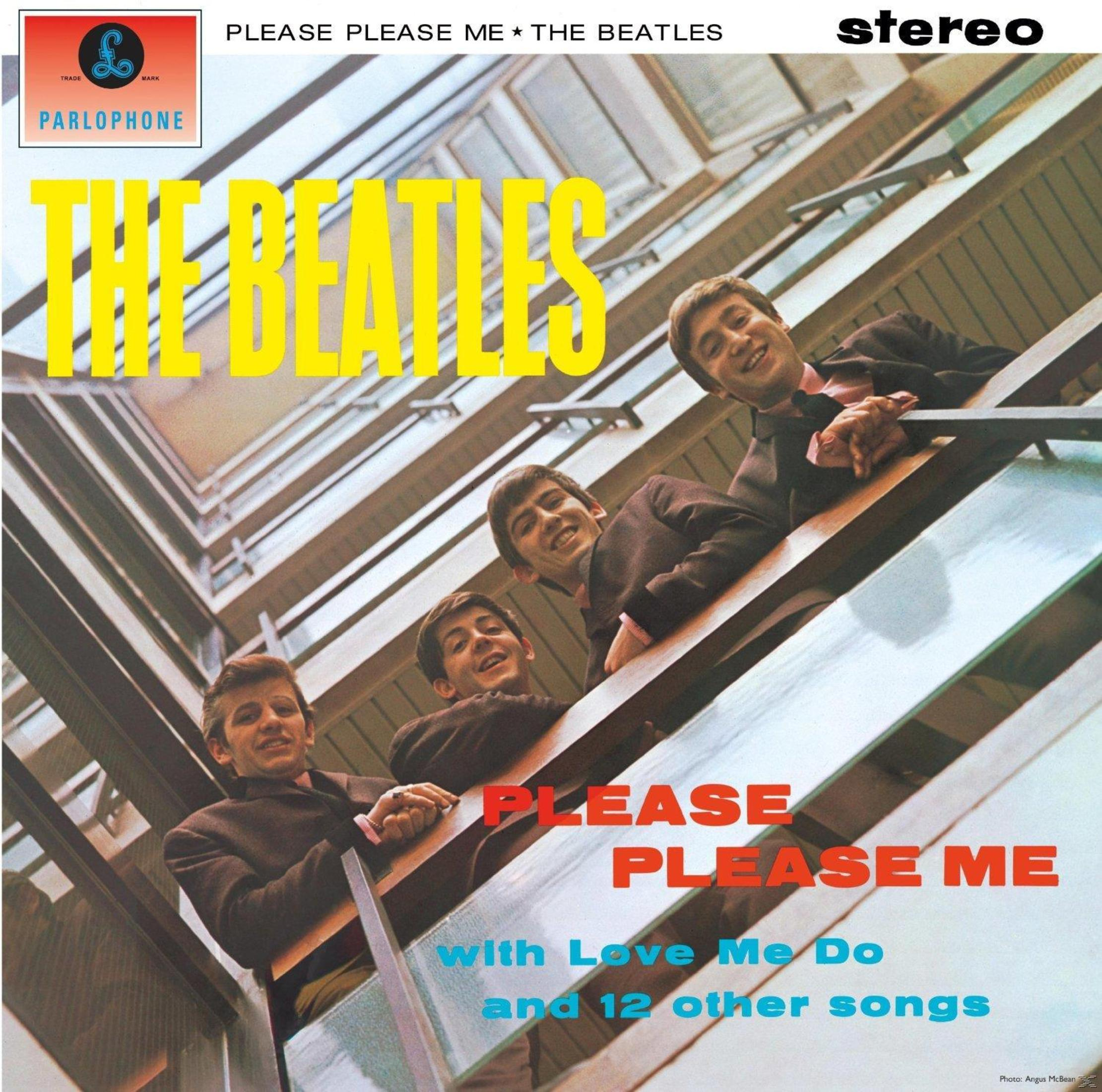 Copertina dell'album dei Beatles. Quattro uomini che guardano da un balcone, testo in basso.