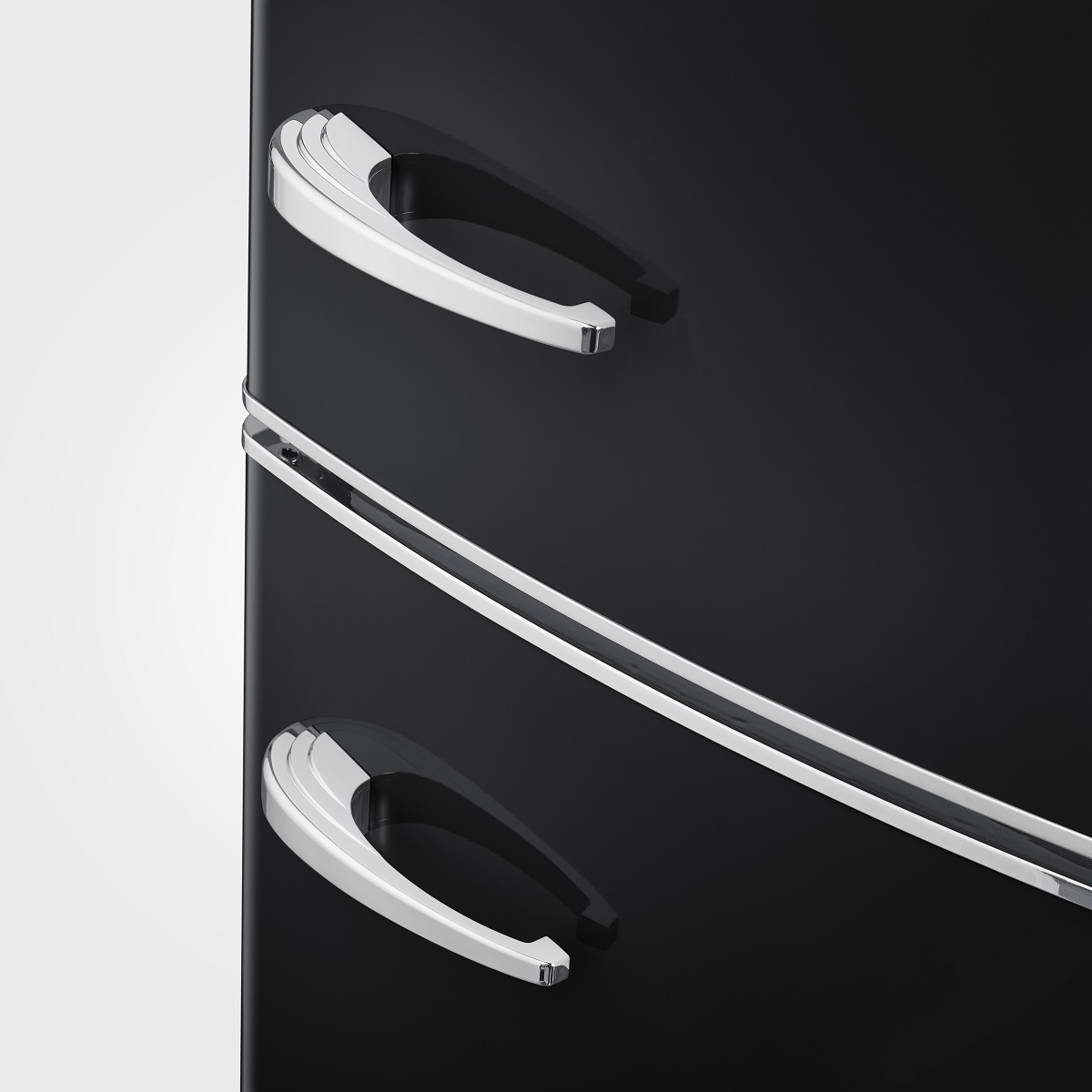 Black refrigerator with silver handles. The handles are curved and sleek.