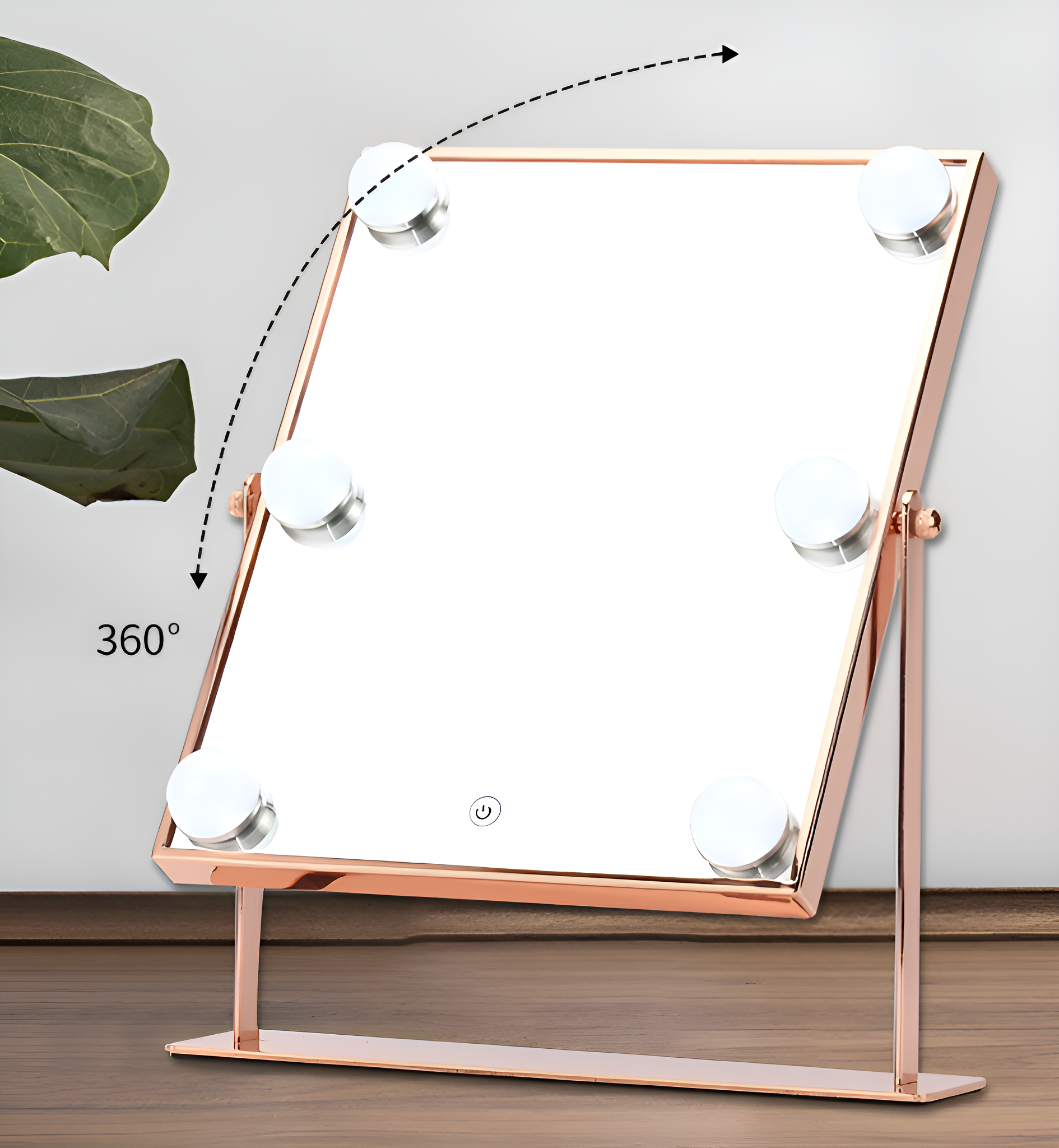 Schminkspiegel mit Lichtern, roségoldfarbener Rahmen. Er hat eine 360°-Drehung und einen Einschaltknopf.