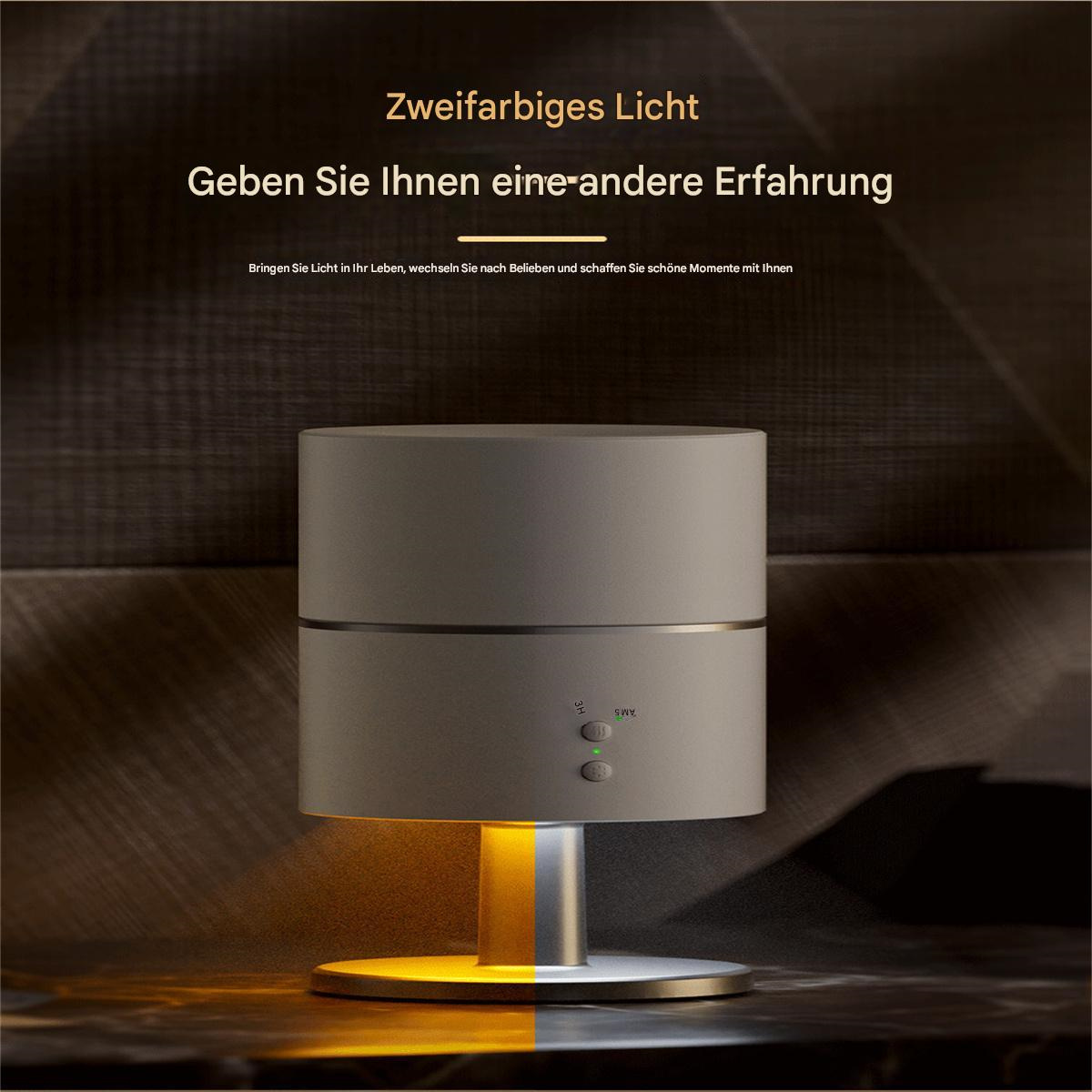 Zylindrische Lampe mit Licht und deutschem Text. Die Lampe steht auf einem metallischen Sockel.