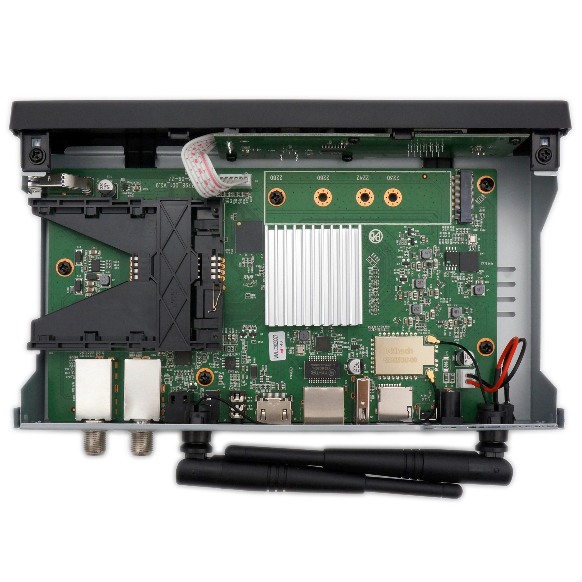 Geöffnetes elektronisches Gerät. Grüne Leiterplatte, Antenne und andere Komponenten sichtbar.