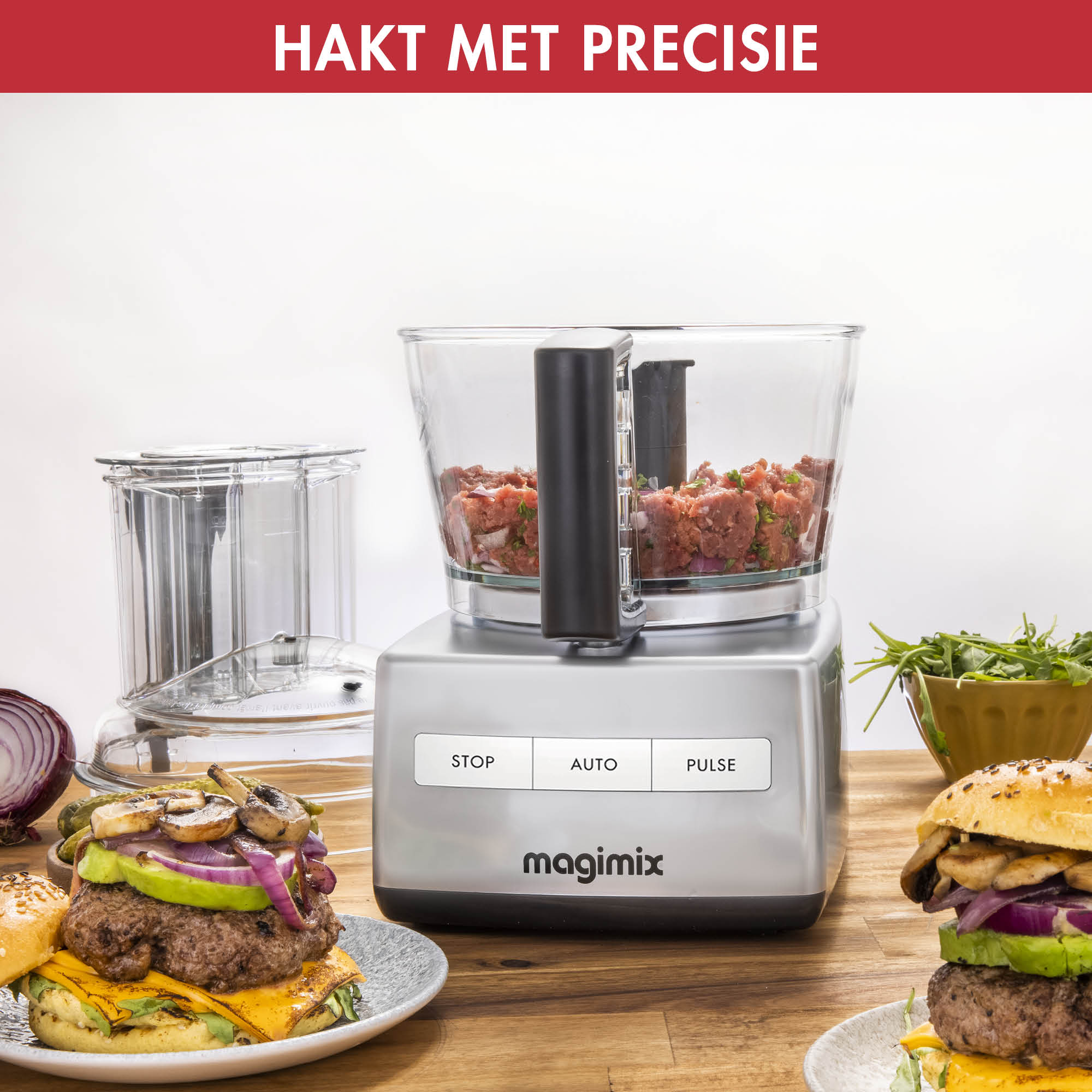 A Magimix food processor, showing raw meat and burgers.