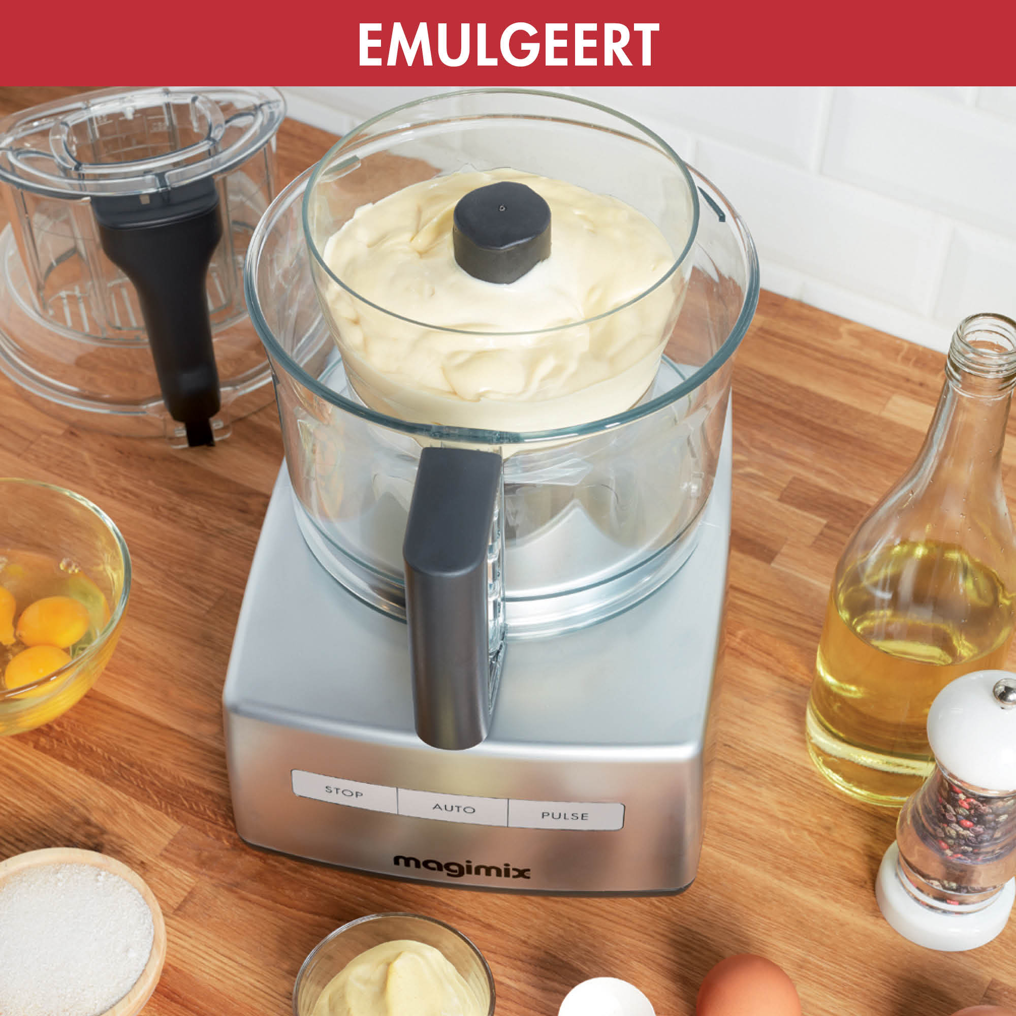 A food processor with ingredients for mayonnaise. Various ingredients are in the frame.