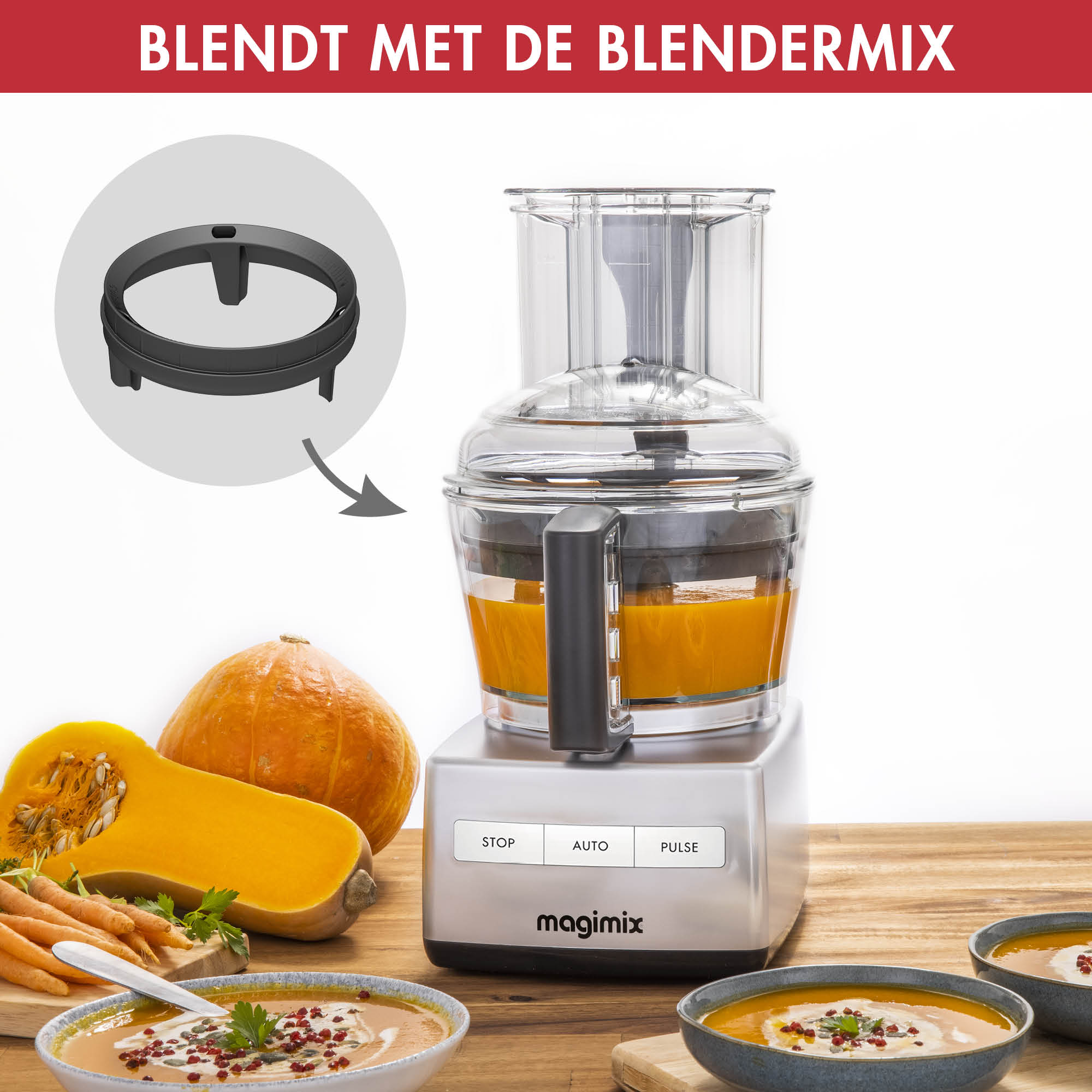 A silver food processor blending orange soup. Pumpkins, carrots, and bowls with soup are visible.
