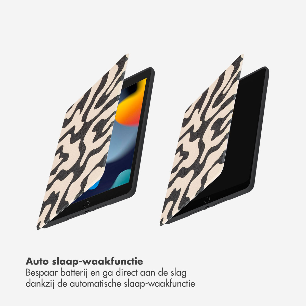 Two open tablets, one with a zebra-striped cover. The other shows its black screen.