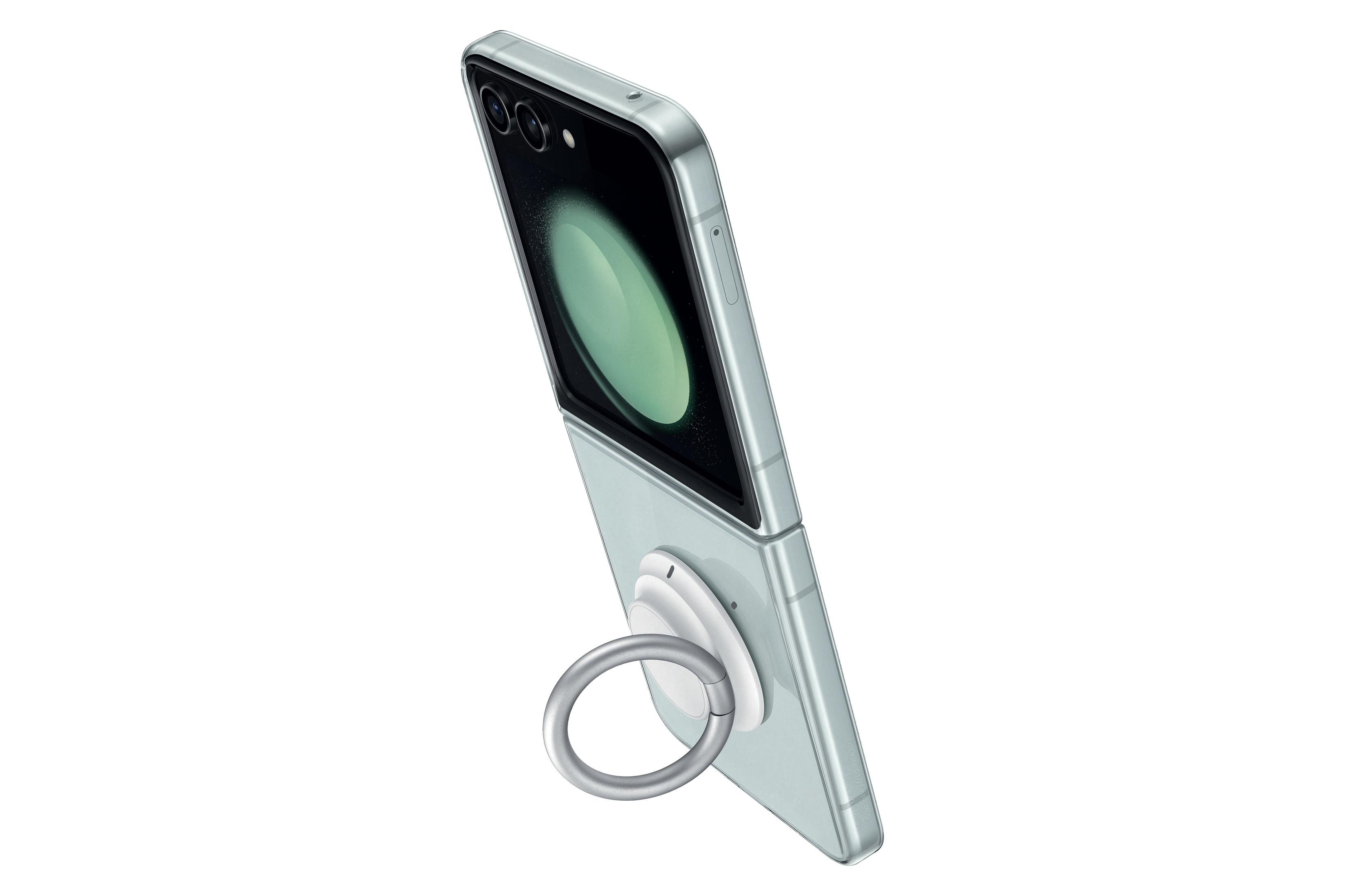 Smartphone verde claro plegado con lentes de cámara y soporte de anillo. La pantalla muestra una imagen verde.